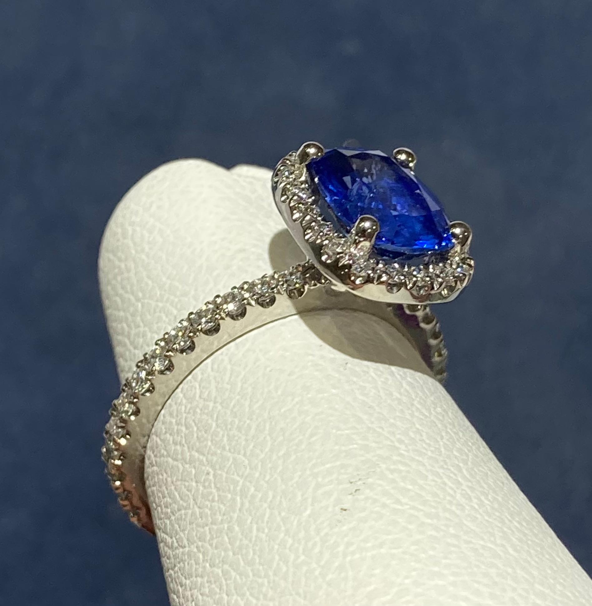 Modern 14 Karat Sapphire and Diamond Halo Ring For Sale