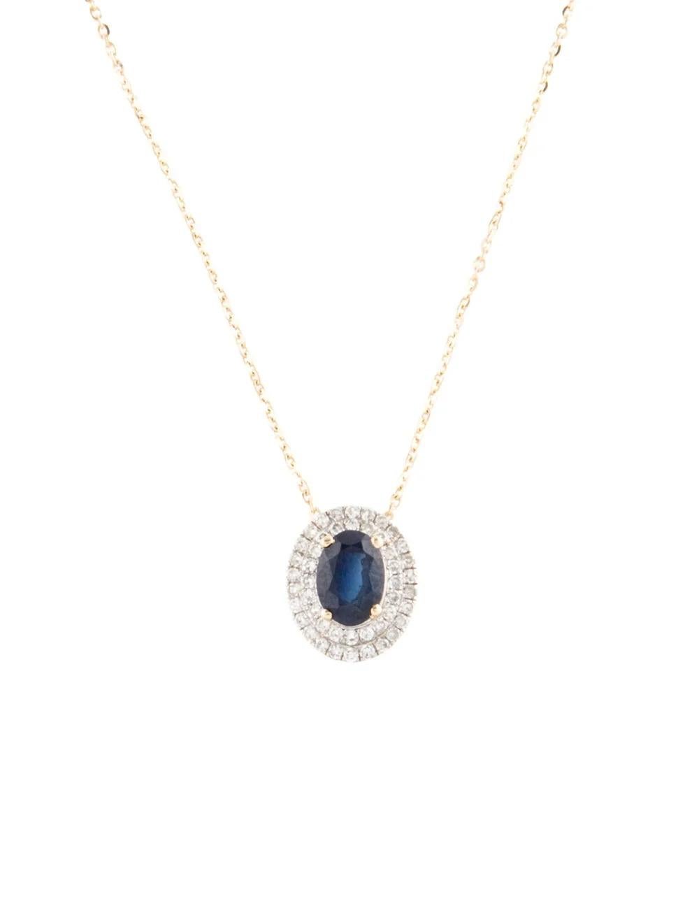Experience timeless elegance with this stunning 14K Yellow Gold Pendant Necklace featuring a captivating 0.86 Carat Oval Brilliant Sapphire as its centerpiece. Crafted with meticulous attention to detail, this exquisite piece exudes sophistication