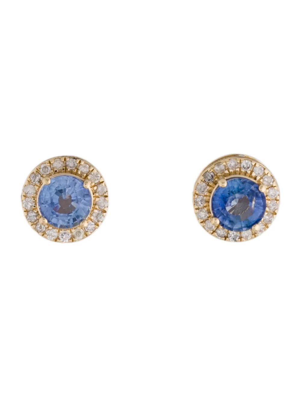 Elevate your elegance with these exquisite 14K Yellow Gold Sapphire & Diamond Stud Earrings. Crafted to perfection, each earring features a dazzling 1.24 Carat Round Brilliant Sapphire, accented by a halo of 34 sparkling Round Brilliant Diamonds