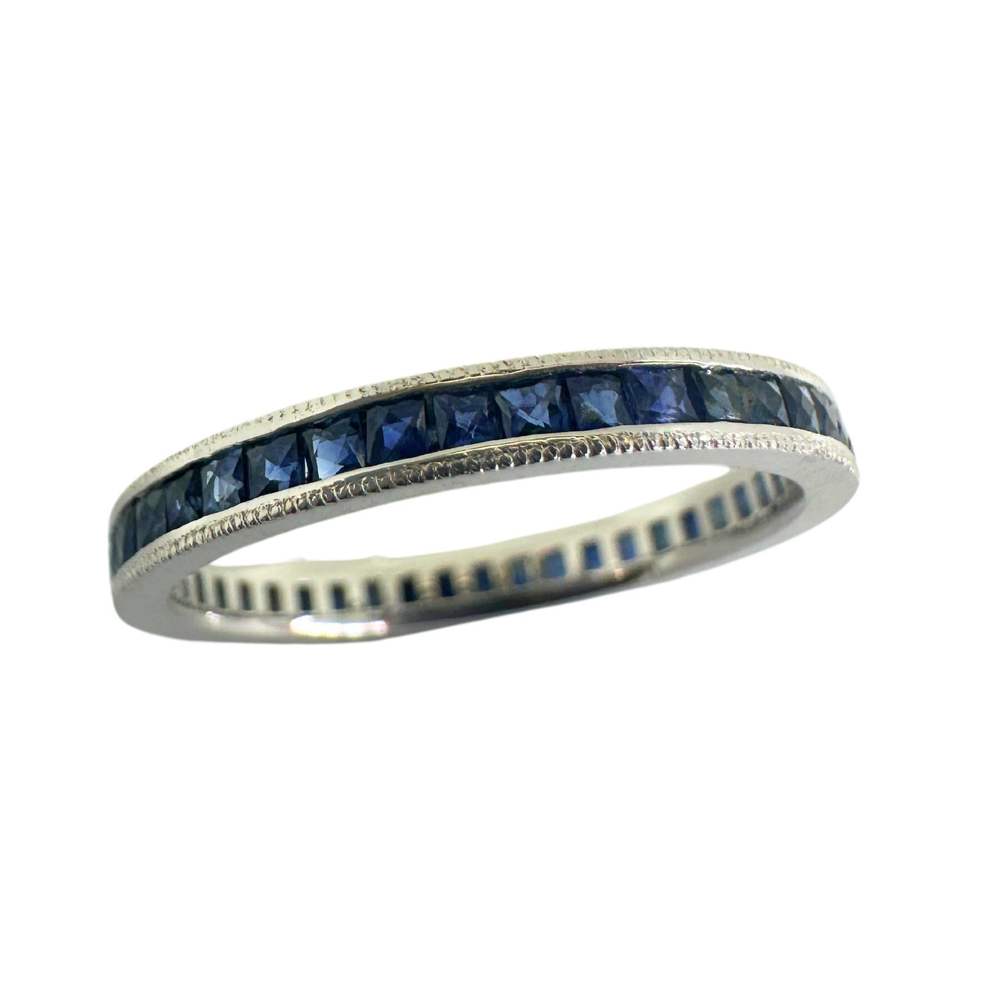 This 14K sapphire eternity ring exudes timeless elegance. Its 0.80 carats of French cut sapphire complements the delicate 2.29mm wide band, crafted from 14k white gold weighing 1.44 grams. In good condition with minor surface wear, this ring is a