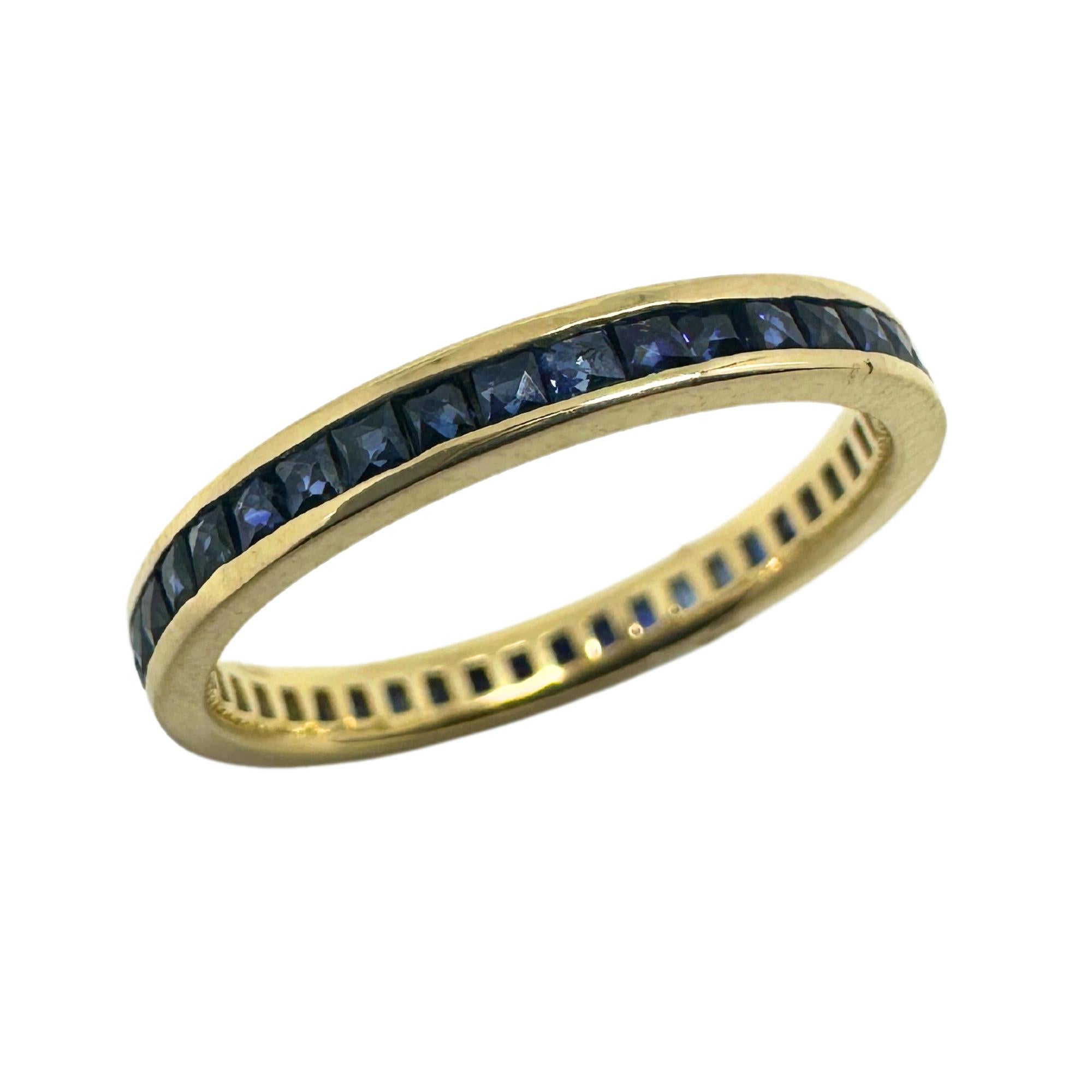This 14K yellow gold eternity ring features a total of 0.82 carats of sapphire, adding a touch of elegance to any outfit. In good condition with minor surface wear, it weighs 1.49 grams and is marked with 