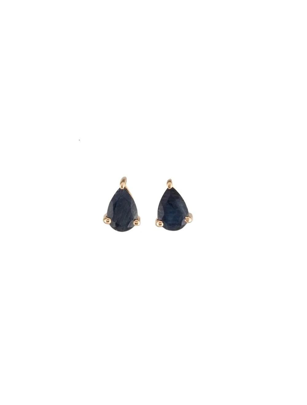 Elevate your elegance with these stunning 14K yellow gold stud earrings, showcasing exquisite 0.86 carat pear modified brilliant blue sapphires. Crafted to perfection, these earrings are a testament to timeless beauty and