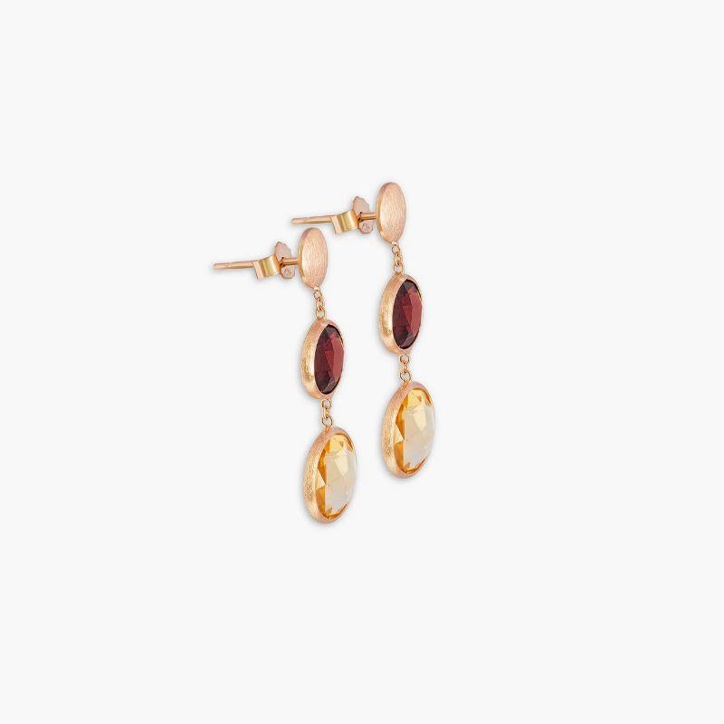 Orecchini a doppia goccia Kensington in oro rosa satinato 14K con granato e citrino

Questi orecchini a goccia presentano due pietre sfaccettate che penzolano da una catena corta. Ogni pietra è incastonata e ha un significato unico: il granato è la