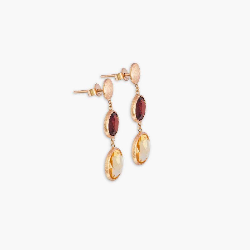 14K satin rose gold Kensington double drop earrings with garnet and citrine

These drop earrings feature two faceted stones that dangle from a short-chain. Each stone is bezel set and holds a unique meaning, with garnet being the stone of protection