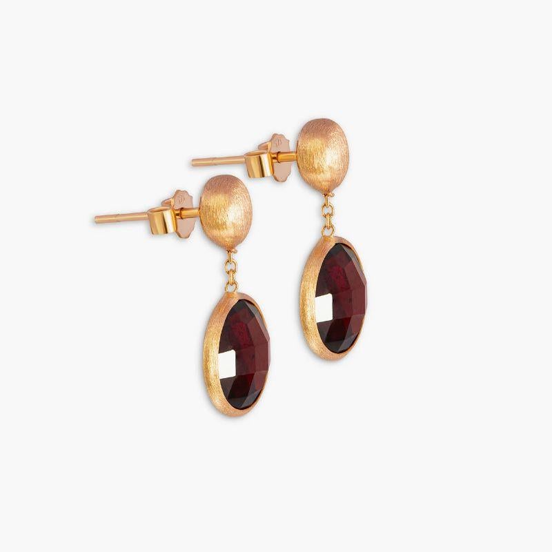 14K satin rose gold Kensington drop earrings with garnet

These drop earrings feature faceted stones that dangle from a short-chain. Each stone is bezel set and holds a unique meaning, with garnet being the stone of protection. These earrings are
