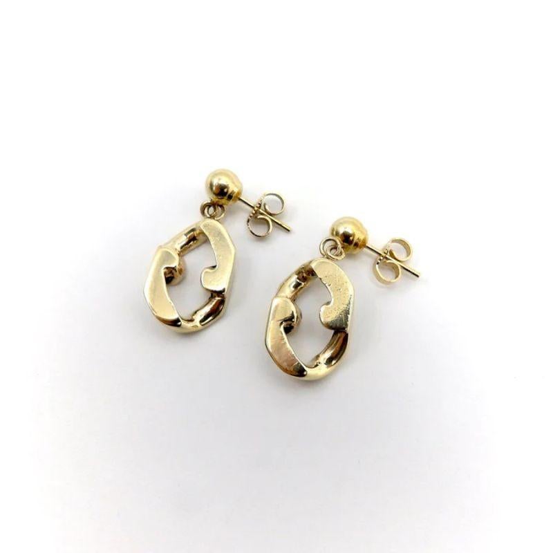 A sweet pair of earrings, with lovely movement and a sculptural design. These vintage links are now earrings and are a Signature item. They were extra links from a bracelet. The single curb-link reminds us of nuggets of gold, that have been shaped