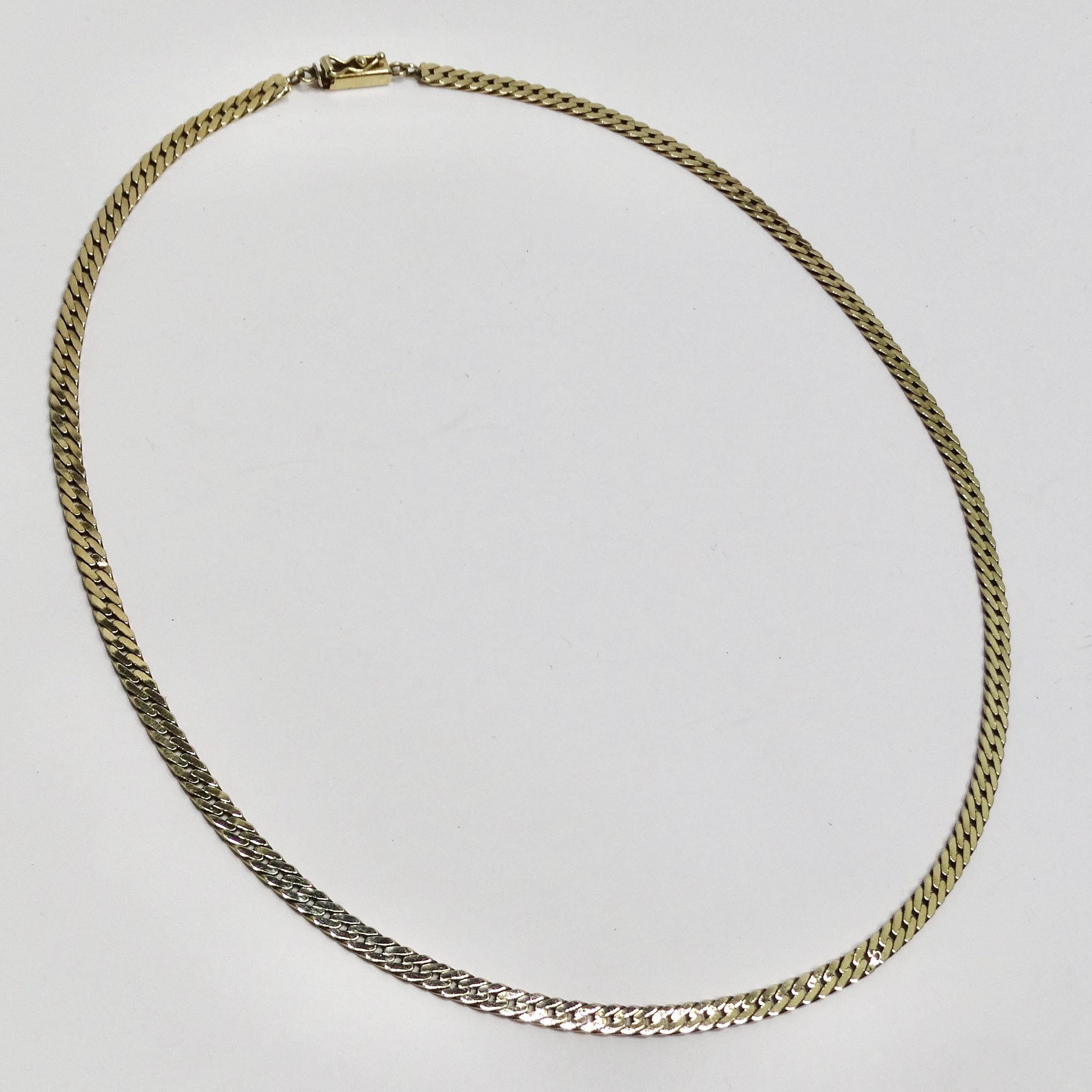 Do not miss out on the 14K Solid Gold 1980s Chain Necklace—a timeless and essential addition to your jewelry collection. This delicate chain necklace is not just an accessory; it's a closet must-have, crafted from luxurious 14k yellow gold to