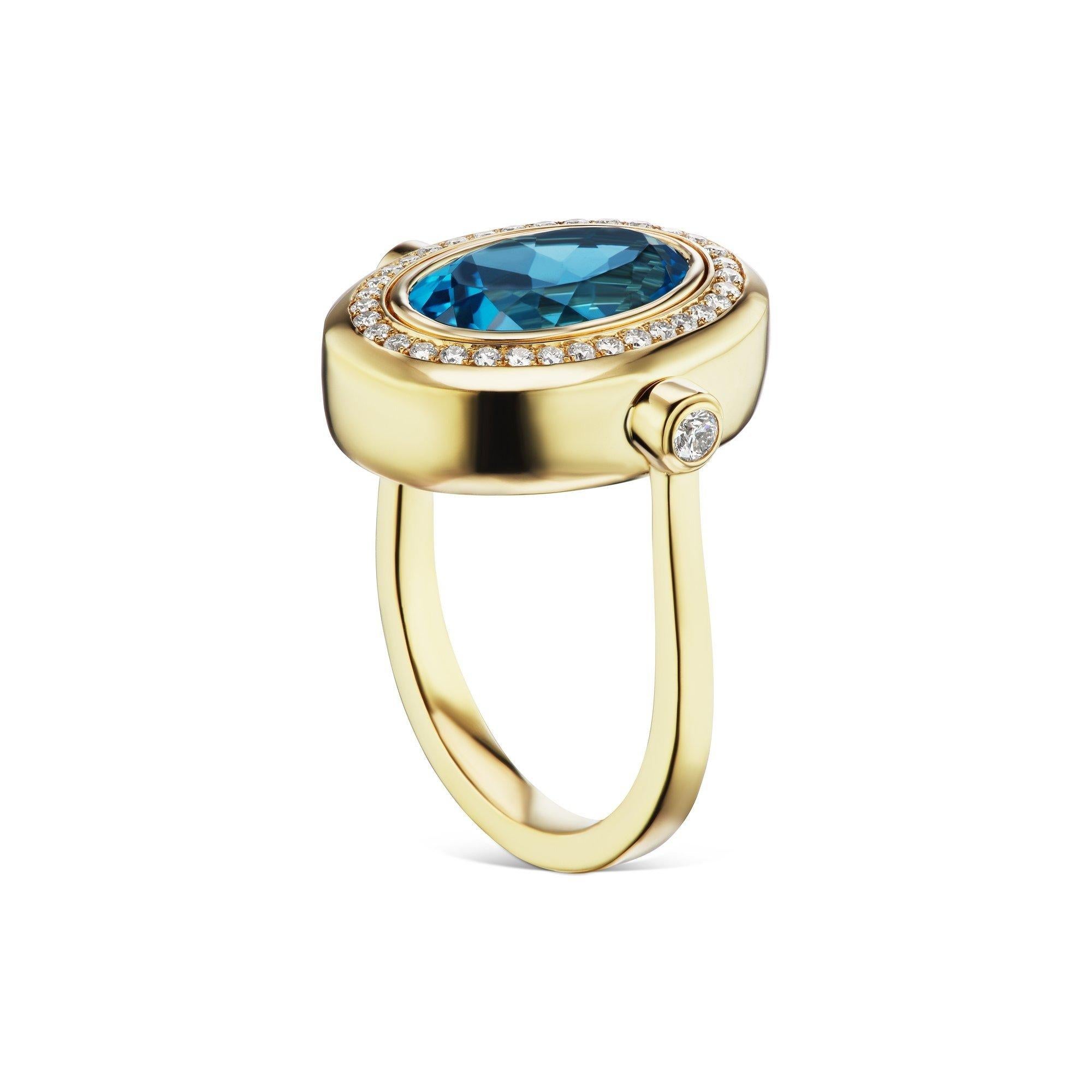 Get lost in the deep beauty of this one-of-a-kind Cocktail Ring featuring a London Blue Topaz center stone surrounded by a halo of White Diamonds. This ring also features White Diamond accents on the shank and is set in 14K yellow gold. 

14k Yellow