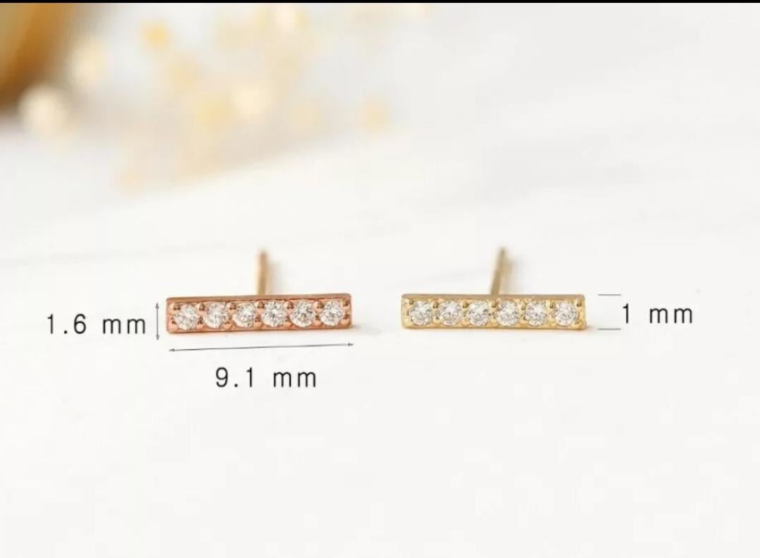 14K Solid Gold Diamond Bar Earrings Minimalist Bar Studs Gold Birthday Jewelry.

Size
9.1x1.6mm Approx
Post length
6.5mm Approx
Diamond Weight
0.09 Ctw Approx
Metal Purity
14k
Closure
Butterfly
Main Stone
Diamond
Item Length
9.1mm Approx
Base
