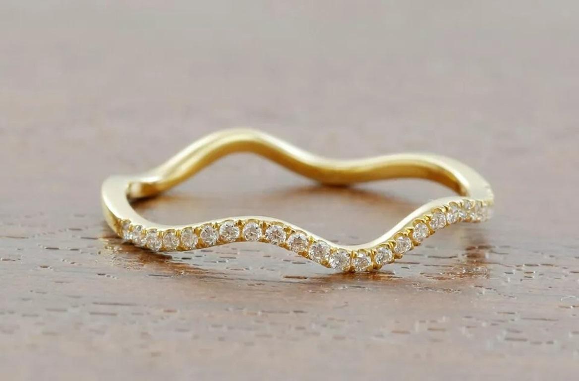 14k Solid Gold Diamond Wave Ring Eternity Diamond Band Ring Stackable Jewelry
Light weight can be worn everyday

Additional information:
Base Metal: Yellow Gold, 14k
Main Stone: Diamond
Main Stone Shape: Round
Secondary Stone: Diamond
Material: 14K
