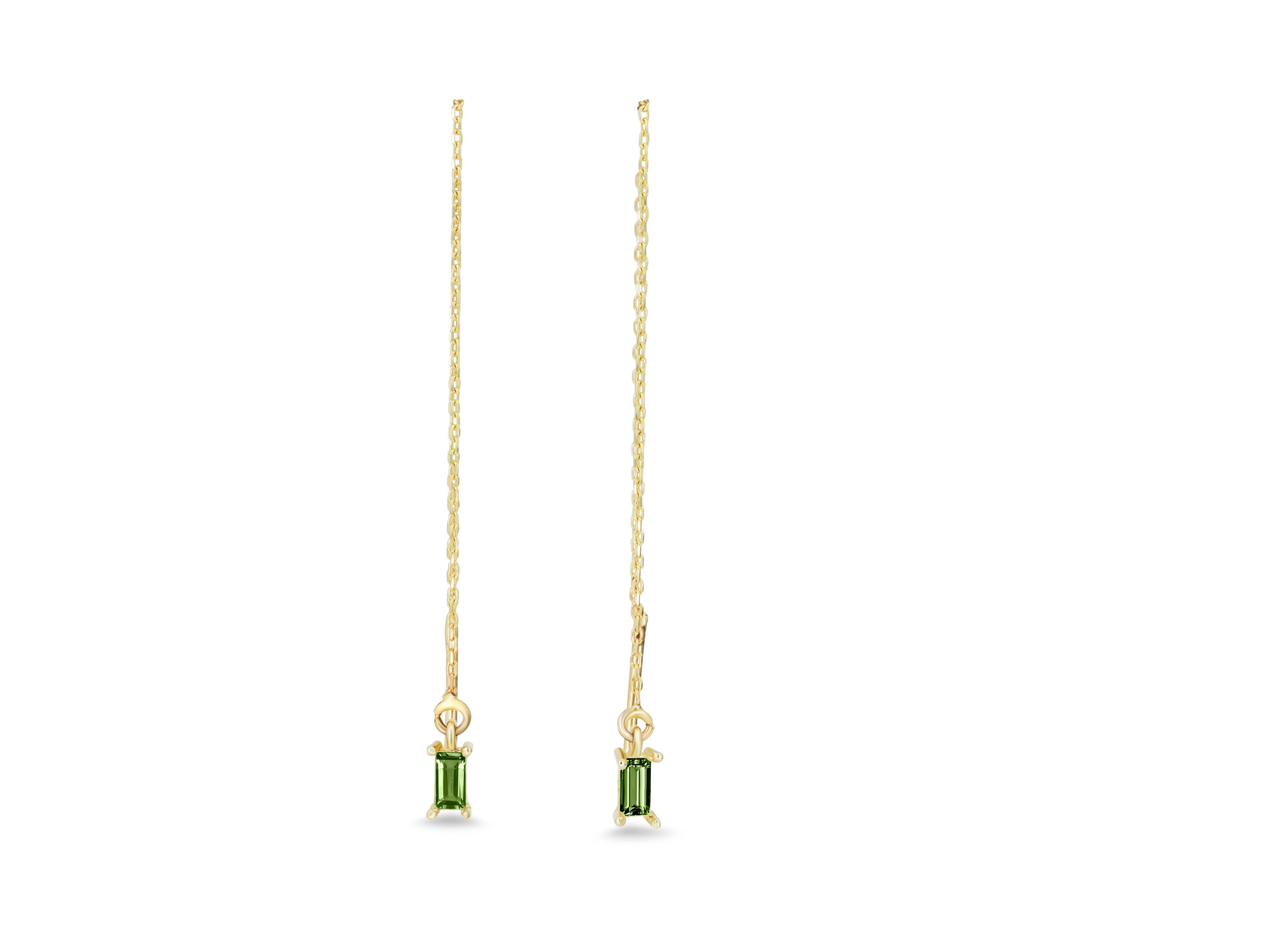 Baguette Cut 14k solid gold drop earrings with peridots.  For Sale