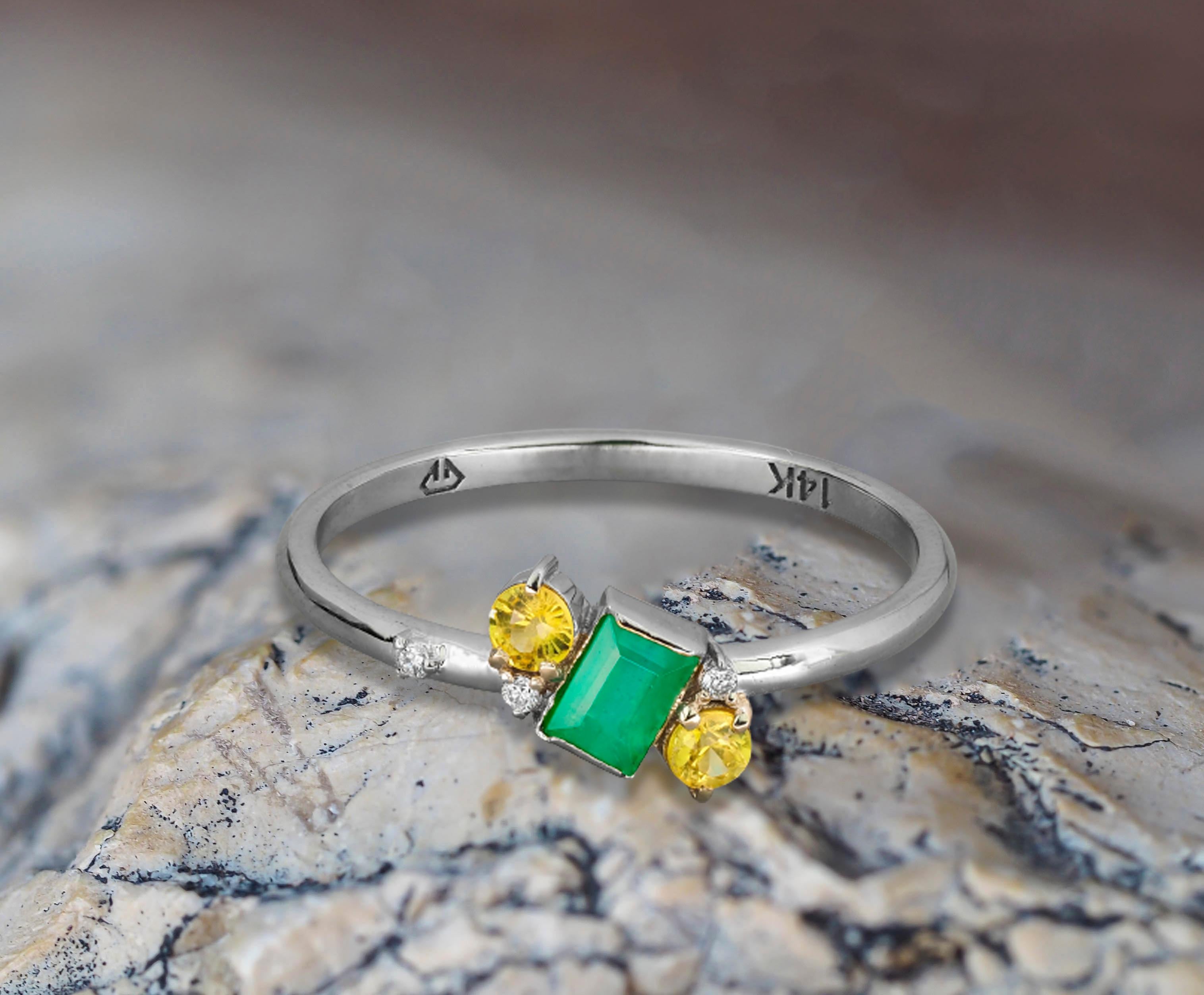 14k solid gold emerald ring. 
Baguette emerald ring. Minimalist ring. Tiny ring. Delicate ring. Emerald engagement ring. May Birthstone Ring.

Metal: 14k gold
Weight: 1.4 g. depends from size.

Set with emerald, color - green
emerald cut, 0.40 ct.