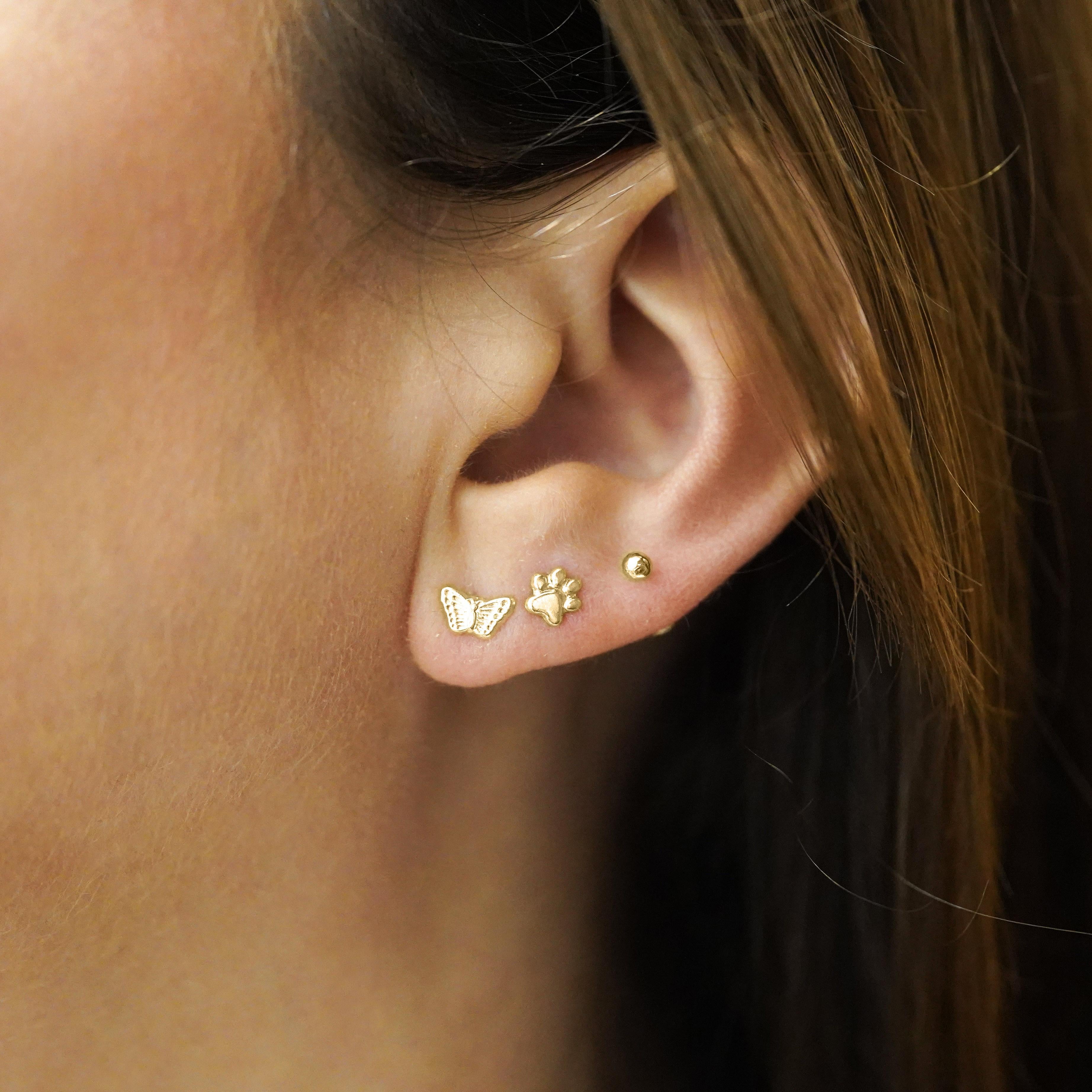 Celebrate nature’s elegance with these 14K solid yellow gold Butterfly Stud Earrings, featuring lifelike detailing and a playful yet sophisticated charm.

Made with real 14 karat solid yellow gold. Not gold plated.

Versatile as earlobe or cartilage