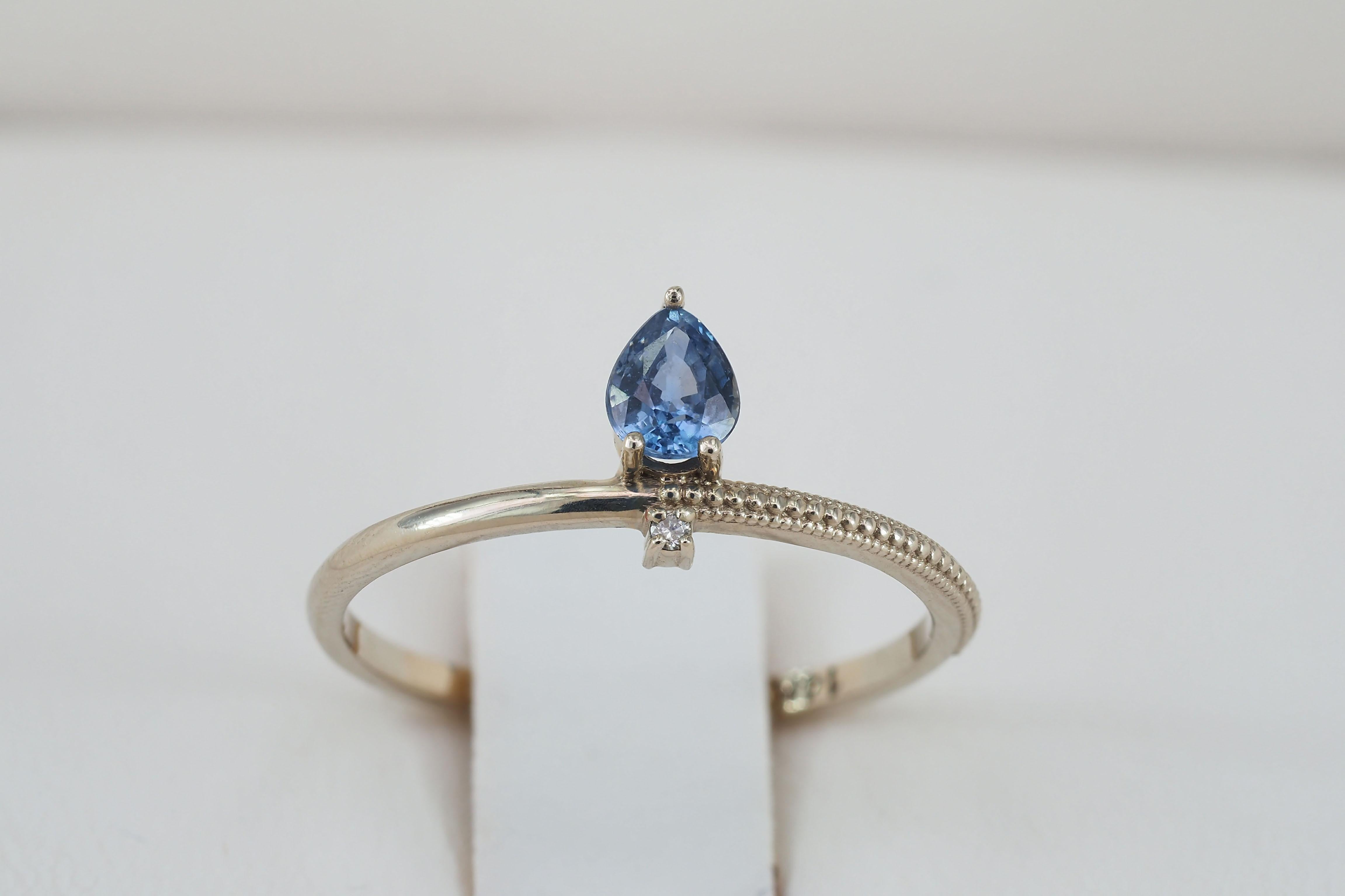 14k solid gold ring with pear 0.5 ct sapphire.  2