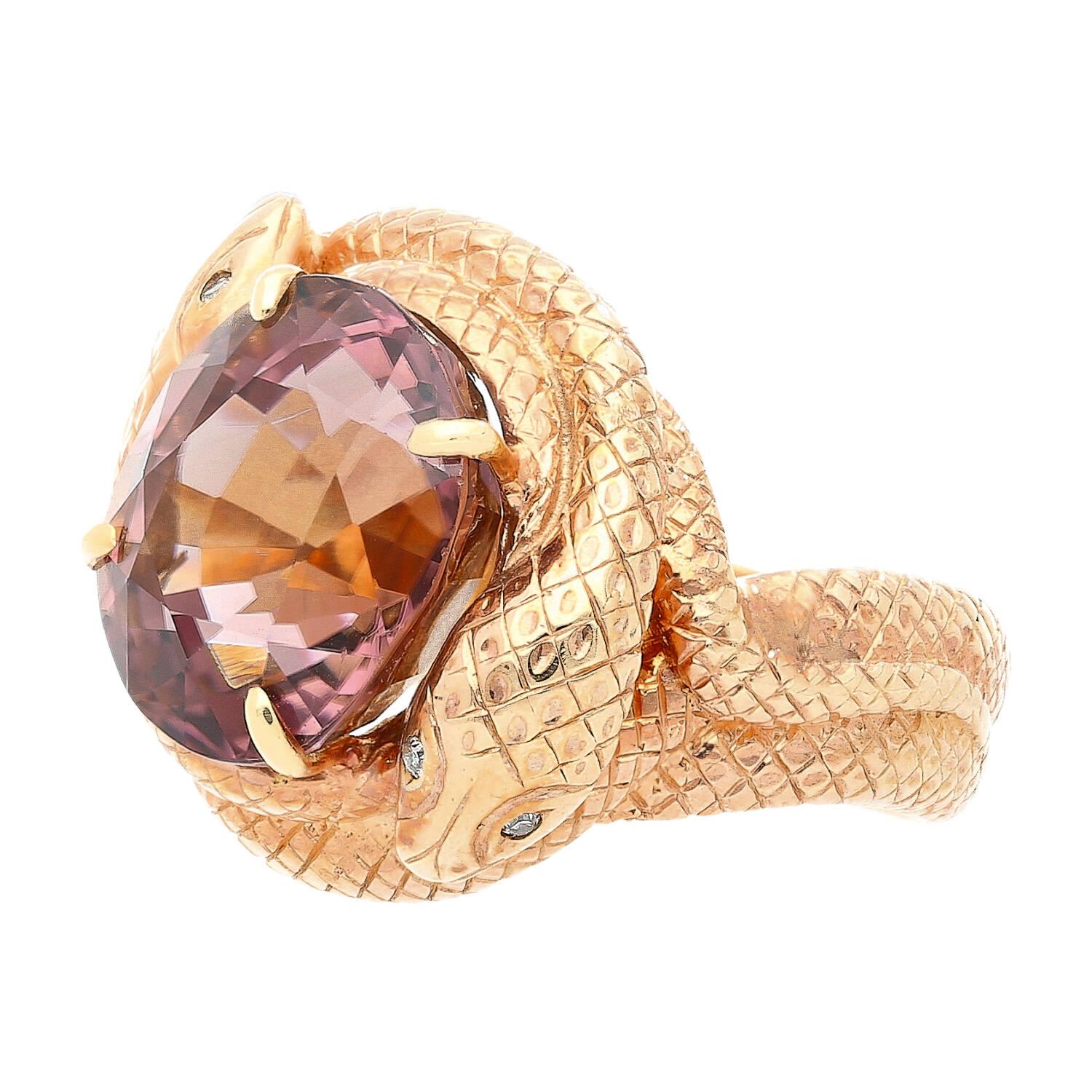 14k solid yellow gold snake ring centering a 10.23-carat pink tourmaline and 4 round cut diamonds set on the snake's eyes. A heavy 17.78-gram masterpiece of fine jewelry. The curved serpentine design is meticulously handmade with a textured