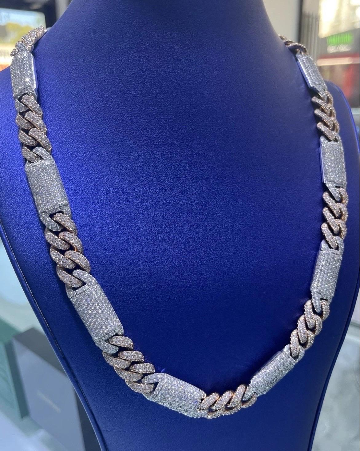 Elevate your jewelry collection with this exceptional 14K solid gold Miami Cuban link chain, masterfully crafted in a striking two-tone finish that combines the warmth of rose gold with the sleek sophistication of white gold. This luxurious chain is