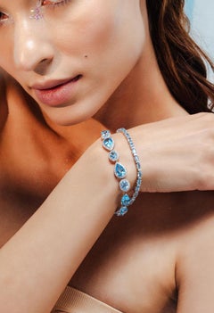 Modern 14k Solid White Gold 8.04 CTW Oval Blue Topaz and Diamond Tennis Bracelet