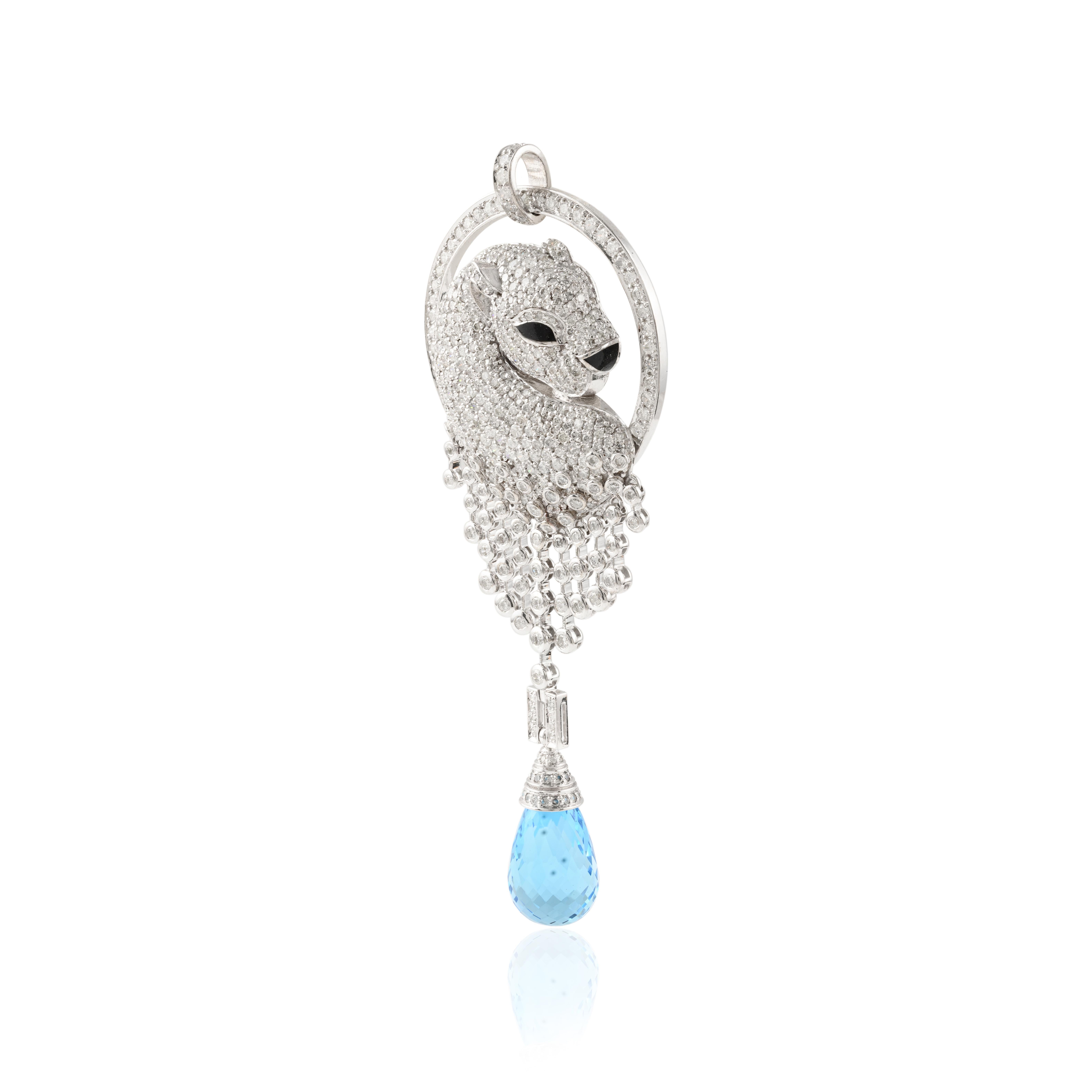 Diamond Panther Pendant in 14K Gold with teardrop blue topaz dangling down. This stunning piece of jewelry instantly elevates a casual look or dressy outfit. 
Panther depicts leadership, fearlessness and strength. Diamond brings love, fame, success