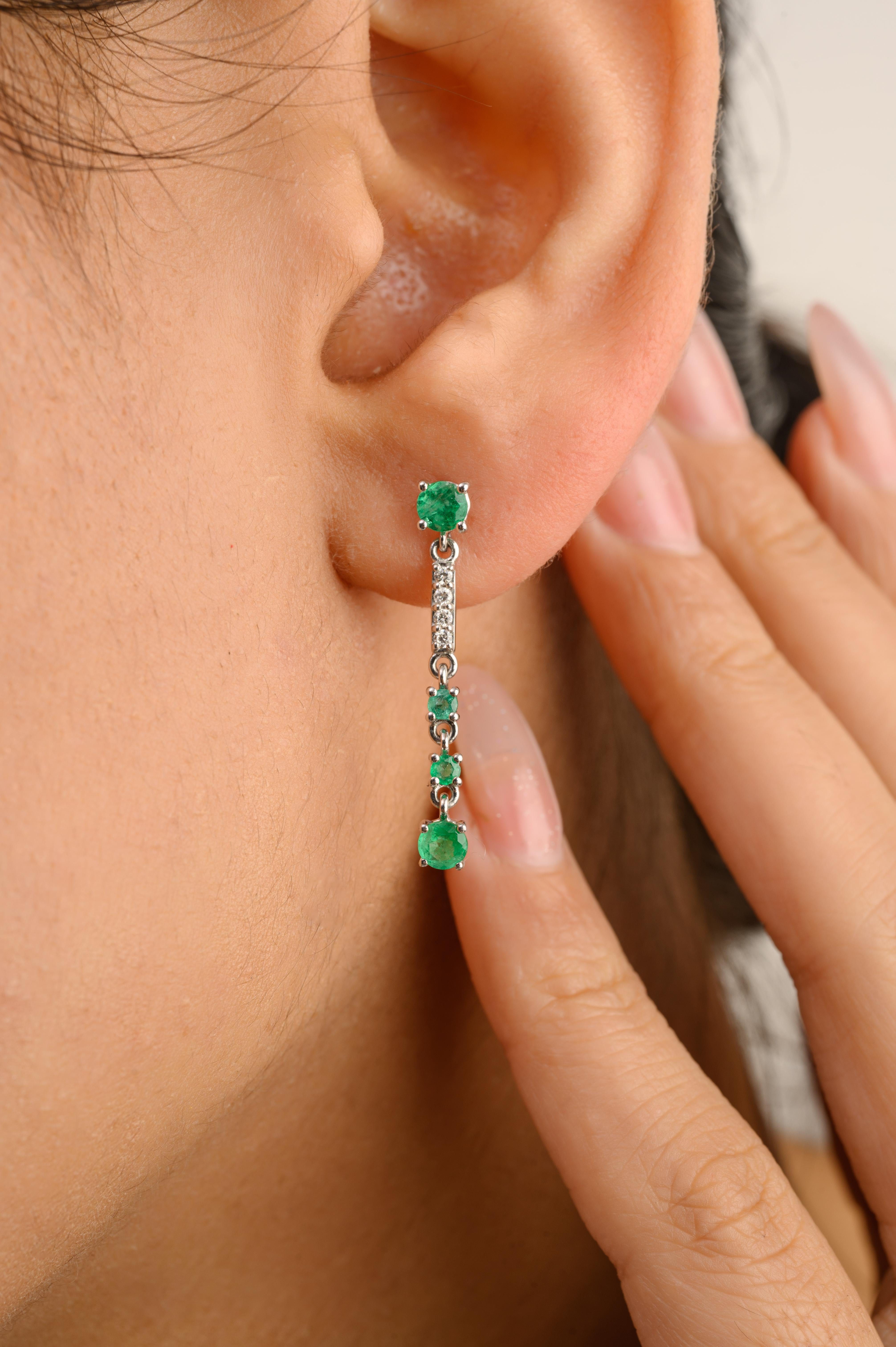 Genuine Emerald Natural Diamonds Long Dangle Earrings in 14K Gold to make a statement with your look. You shall need dangle earrings to make a statement with your look. These earrings create a sparkling, luxurious look featuring round cut emerald