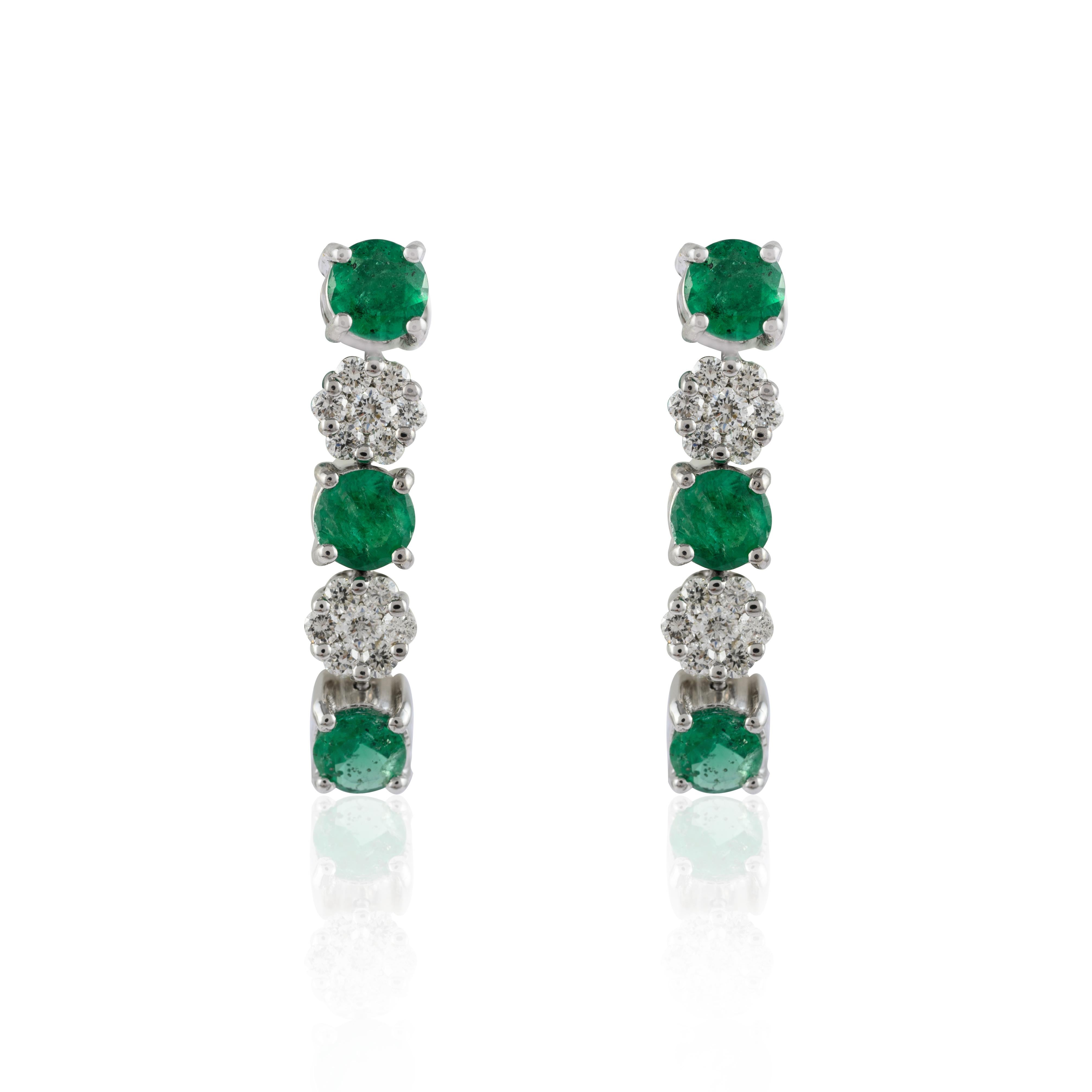 Emerald Diamond Dangle Earrings in 14K gold to make a statement with your look. These earrings create a sparkling, luxurious look featuring round cut emerald.
Emerald gemstone enhances the intellectual capacity of the person.
Designed with alternate