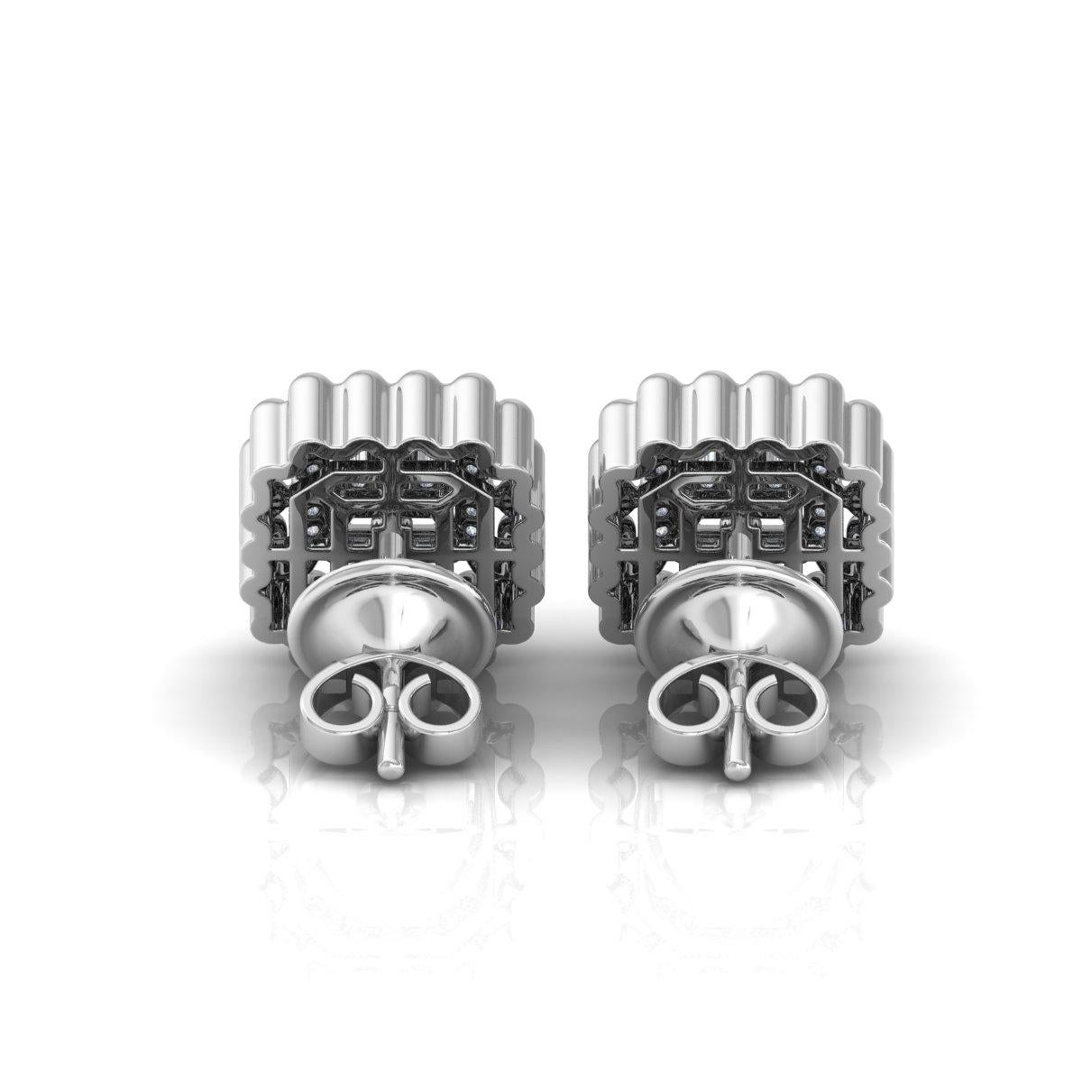 Pendientes de oro blanco macizo de 14k con diamantes en racimo de color HI y claridad SI
Estos bonitos pendientes tienen un diseño de racimo rectangular con un diamante central talla baguette rodeado de un doble halo de diamantes talla redonda. La
