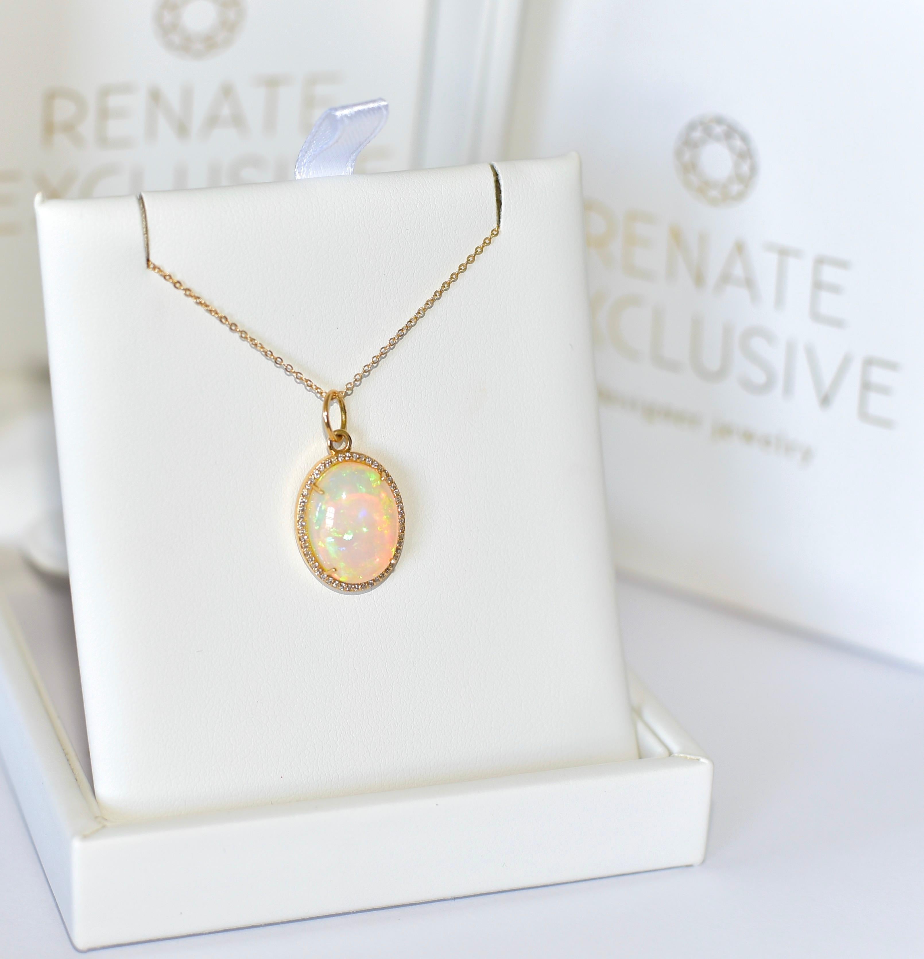
Elegant and opulent! Opal is always a semi-precious stone that you will not be disappointed with! Spectacular 14k solid yellow gold pendant made up of 6.11 carats gem Opal in a classy oval shape. The pendant also has a 0.17-carat fine diamond
