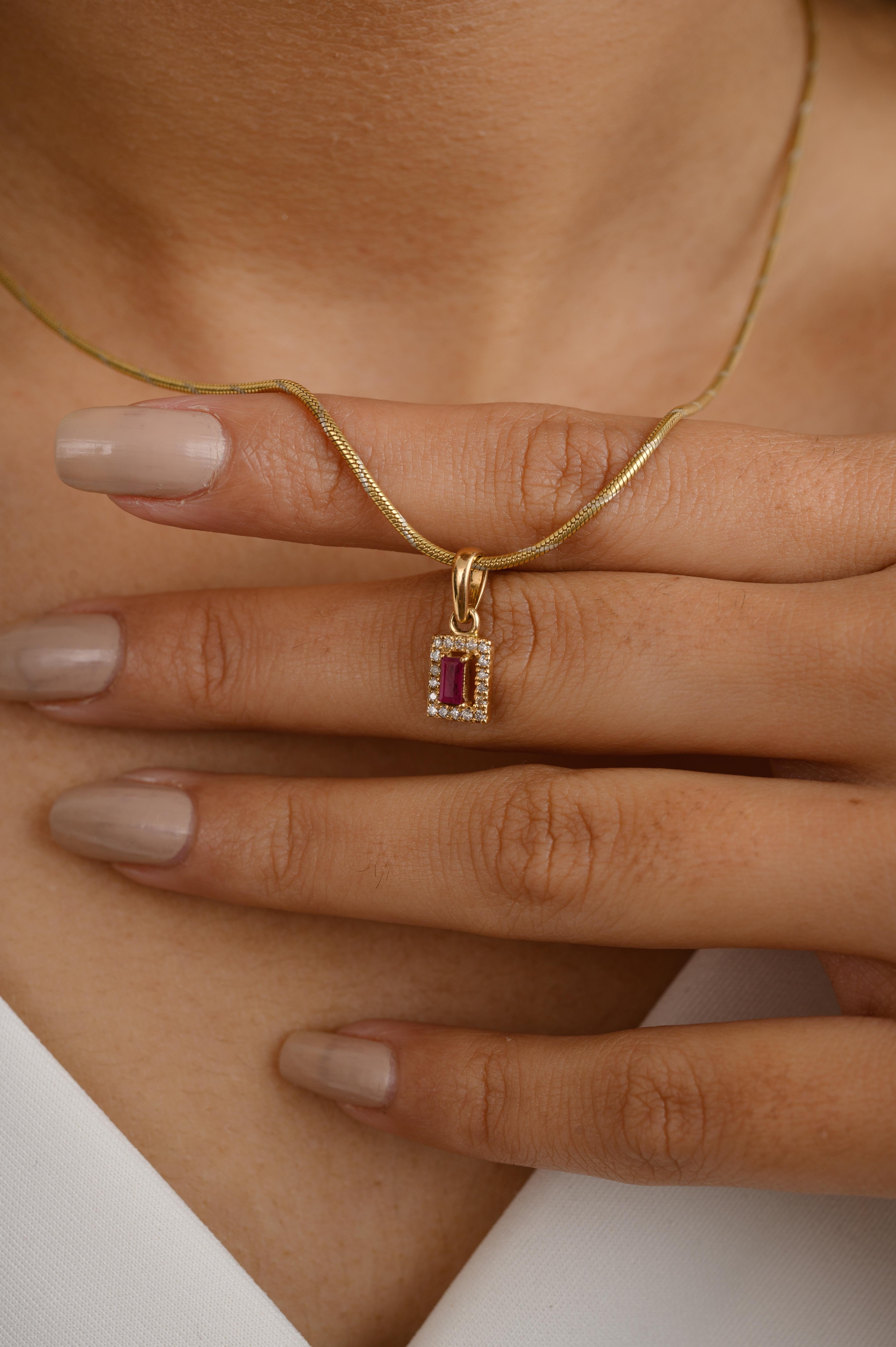 Dainty Ruby Diamond Halo Pendant in 14K Gold studded with baguette cut ruby and halo of diamonds. This stunning piece of jewelry instantly elevates a casual look or dressy outfit. 
Ruby improves mental strength. 
Designed with baguette cut ruby in