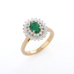 14K Yellow Gold Designer Oval Cut Emerald Ring Mounted with Layers of Diamonds