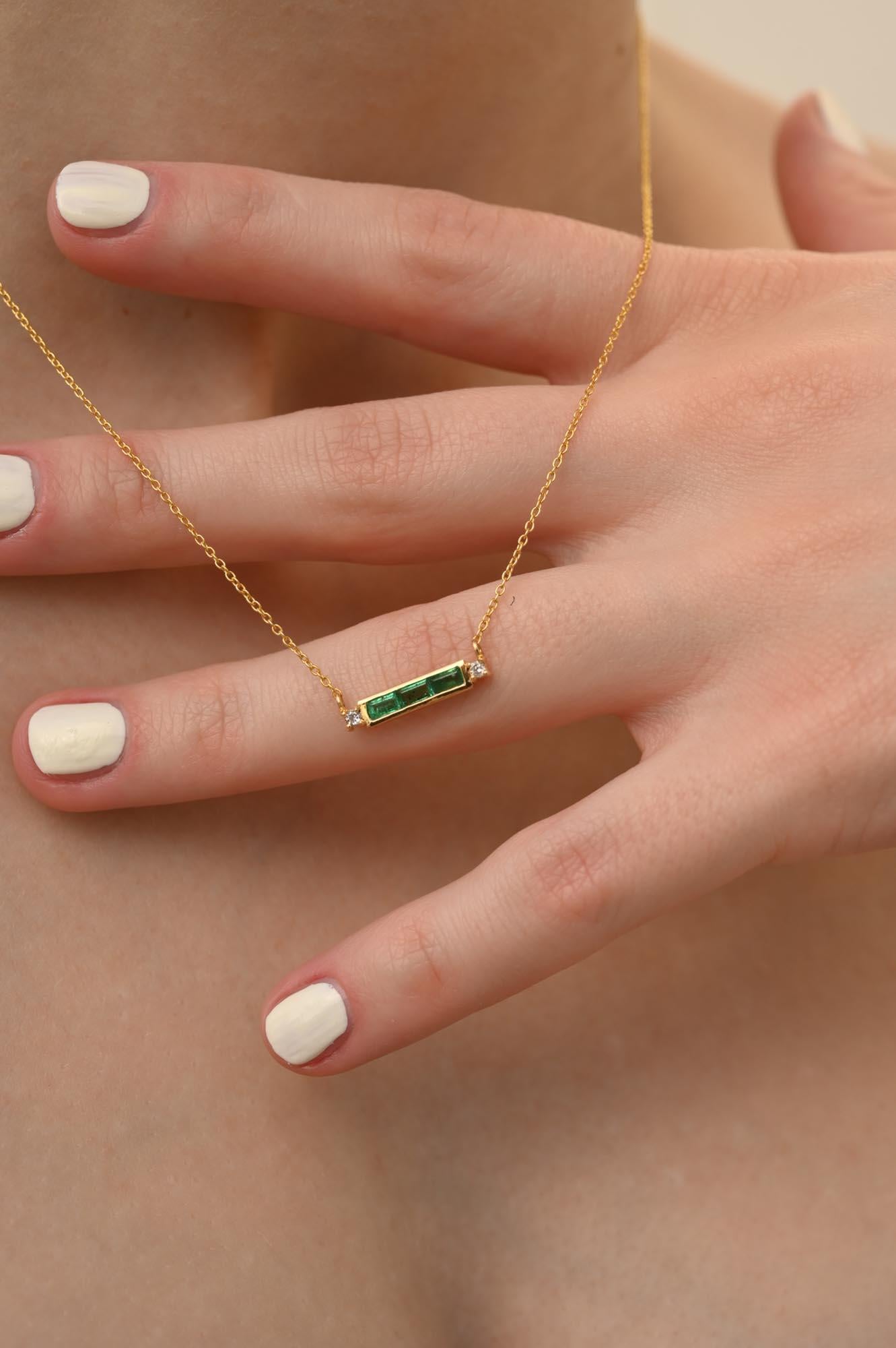 Diamond Emerald Baguette Bar Necklace in 14K Gold studded with baguette cut emerald. This stunning piece of jewelry instantly elevates a casual look or dressy outfit. 
Emerald enhances the intellectual capacity. 
Designed with baguette cut emerald