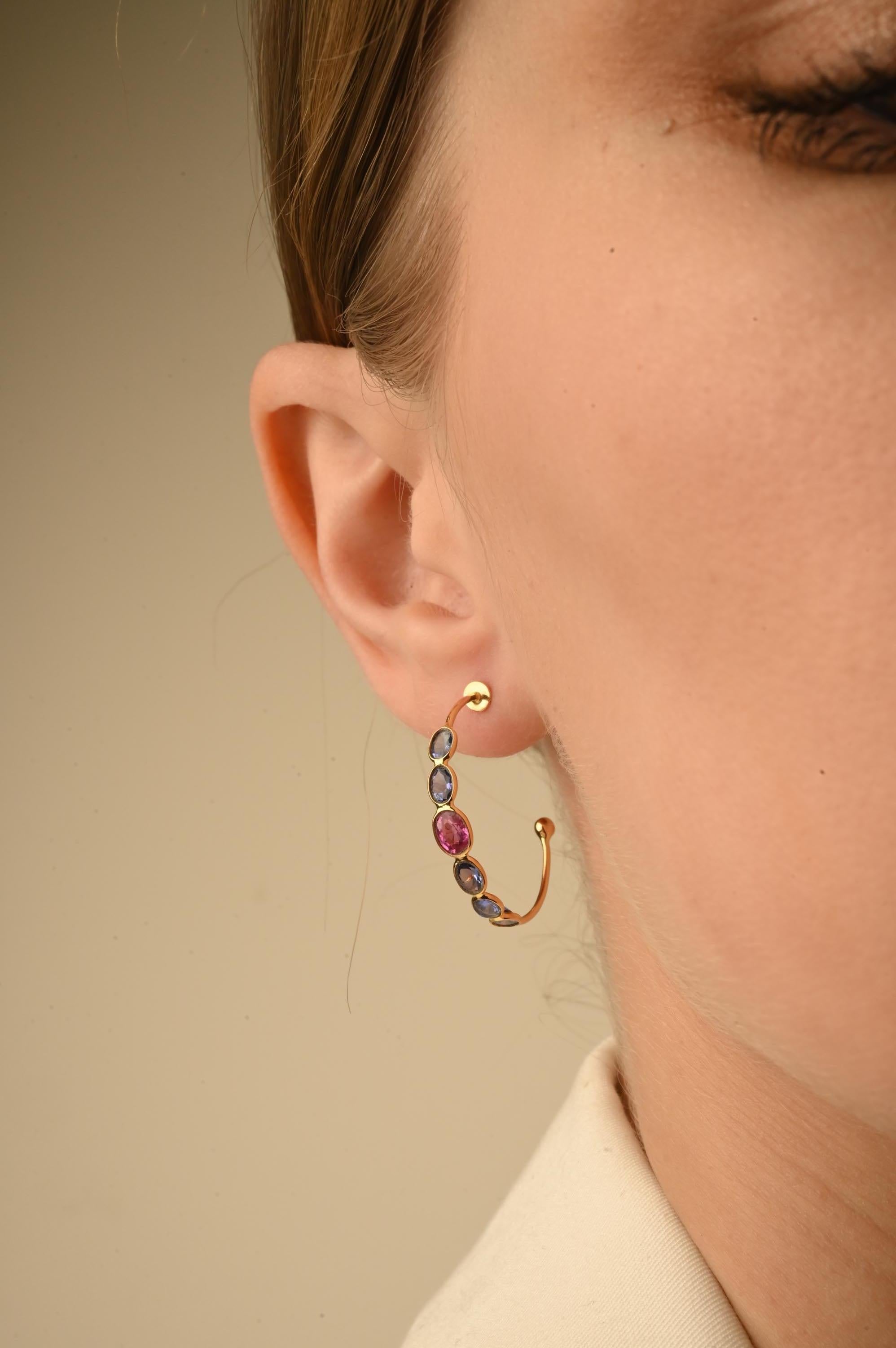 Multi Sapphire Hoop Earrings in 14K Gold to make a statement with your look. You shall need open hoop earrings to make a statement with your look. These earrings create a sparkling, luxurious look featuring oval cut gemstone.
Sapphire stimulates