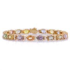 Bracelet tennis en or jaune massif 14 carats avec plusieurs saphirs et diamants