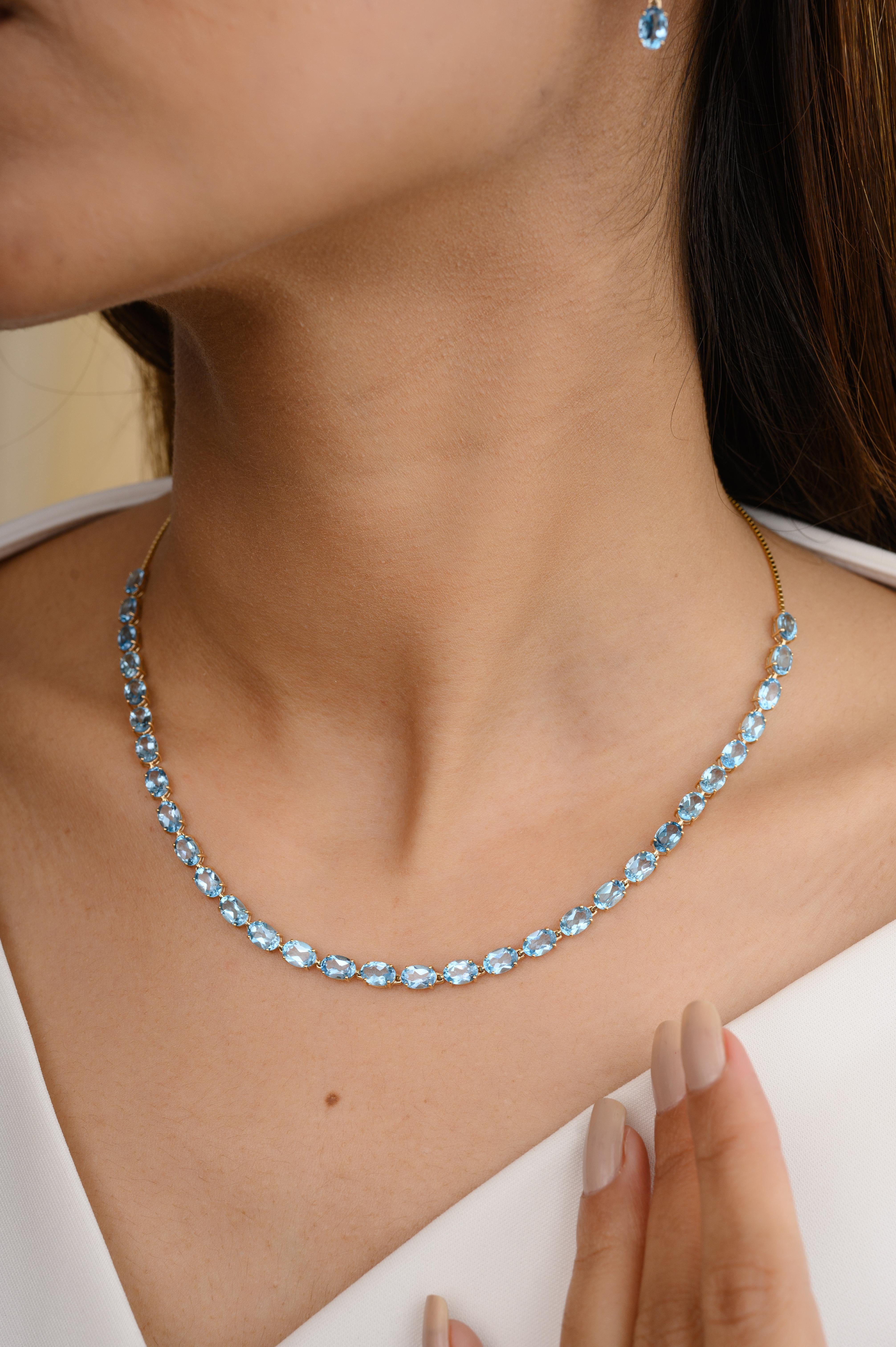 Natural Blue Topaz Gemstone Necklace and Earrings Jewelry Set Crafted in 14K Gold studded with oval cut blue topaz. This stunning piece of jewelry instantly elevates a casual look or dressy outfit. 
Blue topaz promotes truth and forgiveness,