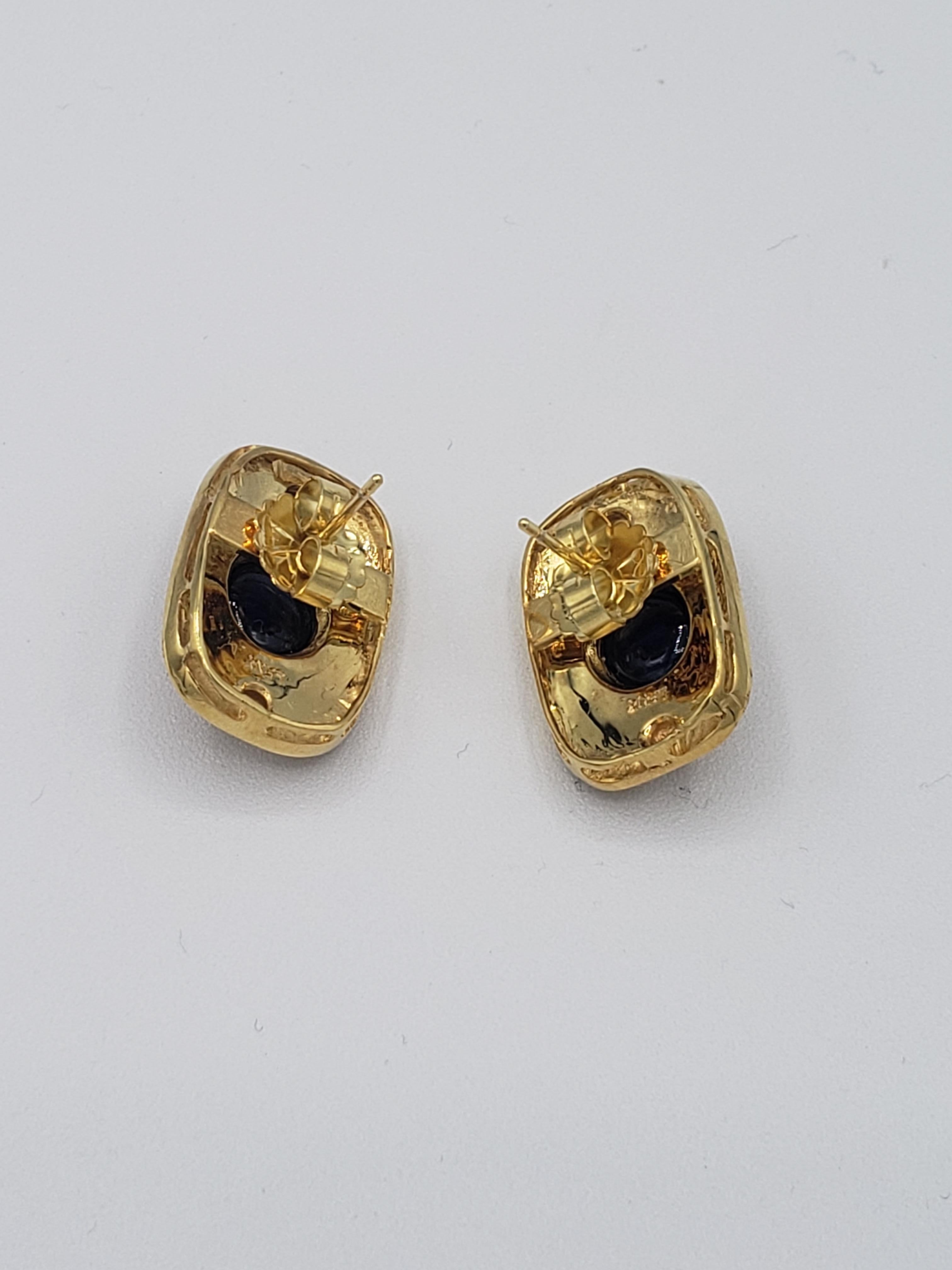 Enhance your jewelry collection with these exquisite oval-shaped blue sapphire earrings from LaFrancee. The stunning pair boasts natural sapphires set in 14k yellow gold, making them a perfect choice for those who appreciate fine jewelry. The