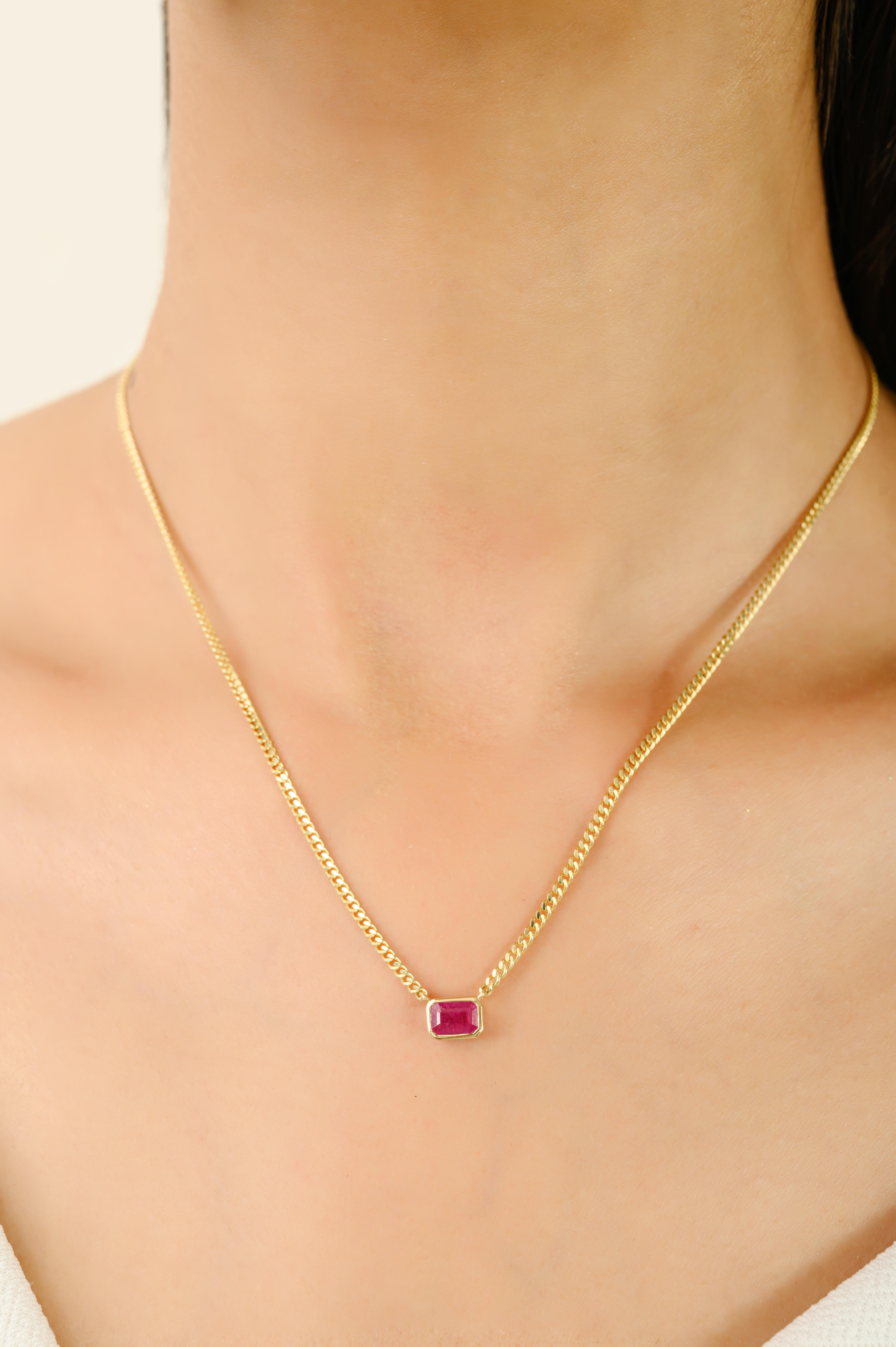 Elegant and timeless, this 14k Solid Yellow Gold Octagon-Cut Ruby Pendant Necklace with Curb Chain features a 0.55 carat octagon-cut ruby set in a sleek 14k yellow gold bezel. Suspended from a classic curb chain, the deep red ruby radiates