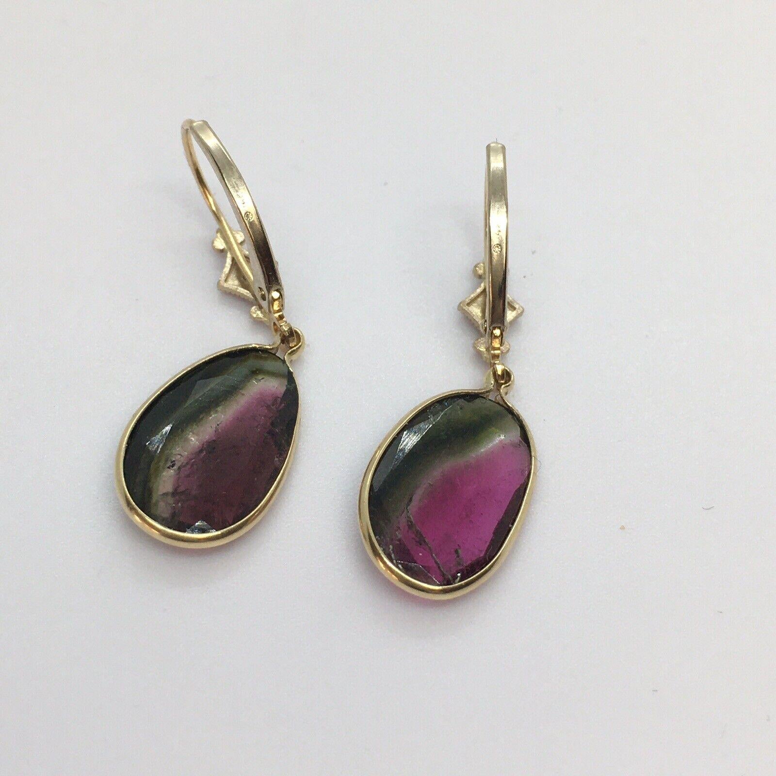 14K Solid Yellow Gold 14mm by 10 mm Rose Cut Bicolor Tourmaline Dangling Wire Earrings


2.3 gram weight
14mm by 10mm Tourmaline
1.25 inch hanging 'from ear lobe'

New Jewelry
Made in our shop at Santa Monica, Ca.