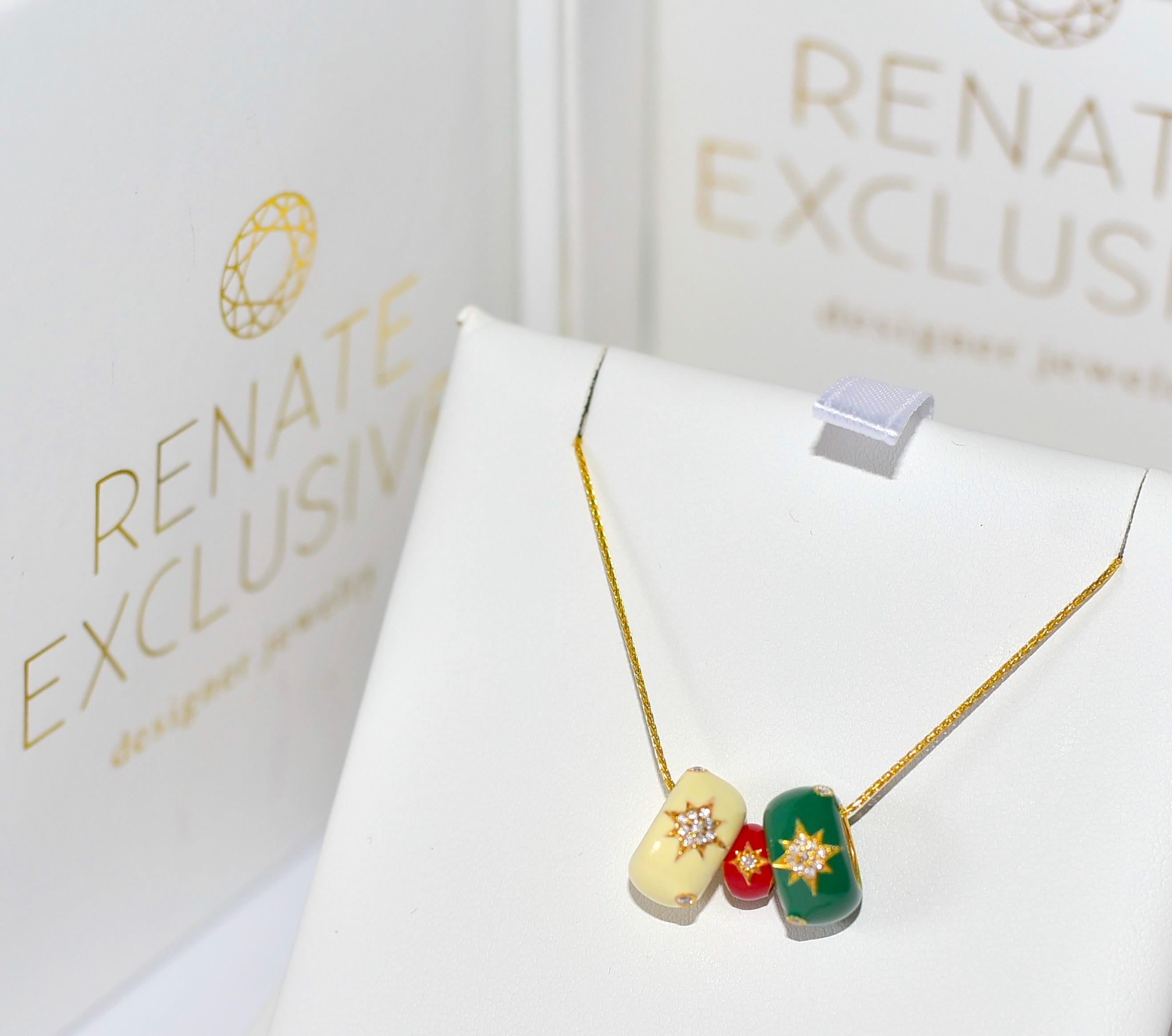 Collier en or jaune 14k en forme d'étoile avec diamant et émail vert émeraude, blanc perle et rouge. 
J'ai nommé ce collier 