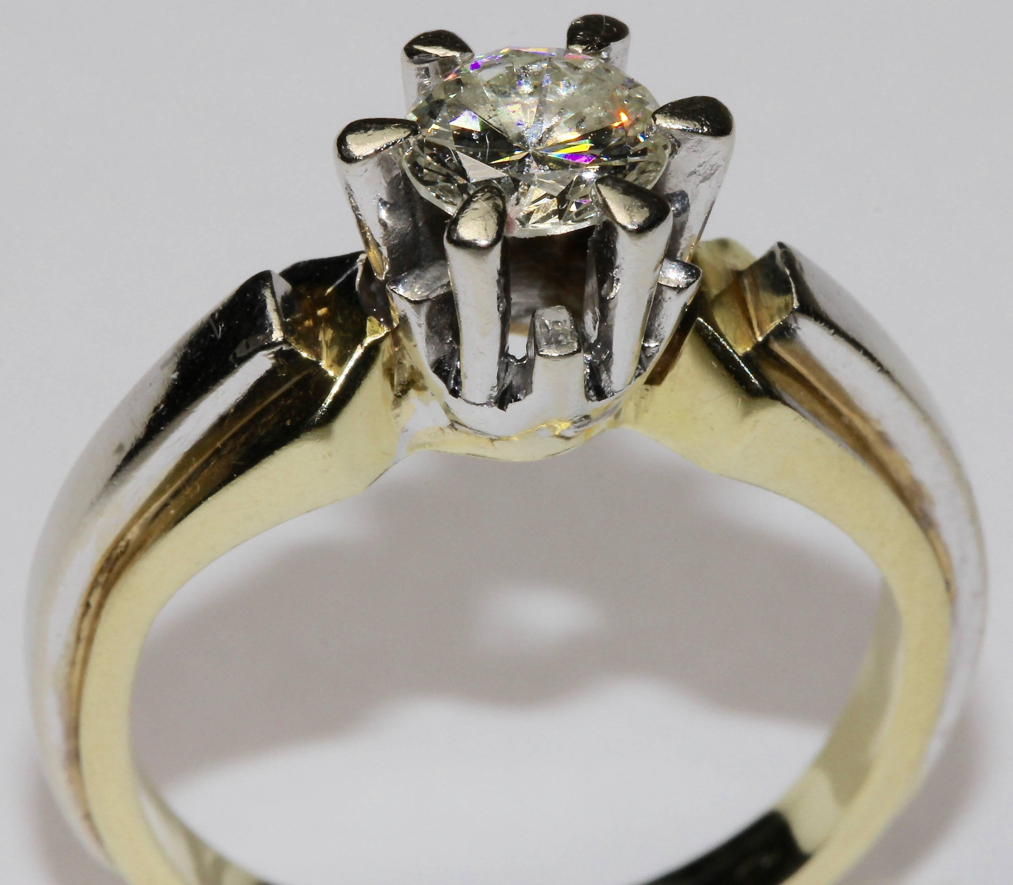 Fantastic solitaire Ring with large round diamond in claw setting.
Size and Quality approx. 0.82 carat (engraved in frame), VVS, color F.
14k yellow gold and white gold frame.
Hallmarked.

In the photo, the solitaire appears a bit yellowish and