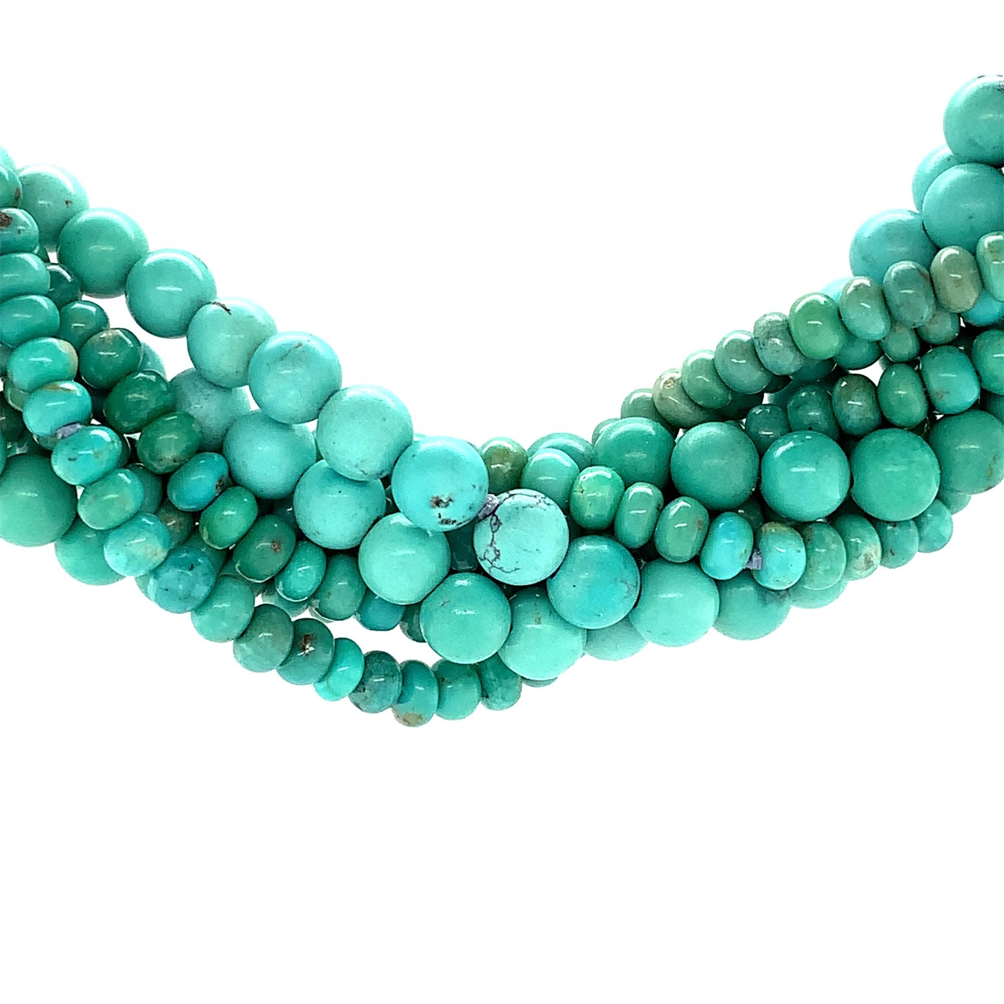  An 8 strand natural Sonoran turquoise torsade necklace with 14K yellow gold magnetic clasp. There are 5 strands of Campitos turquoise 4mm beads and 3 strands of Campo Frio turquoise 6mm beads. There is a total of 384 carats of turquoise. The