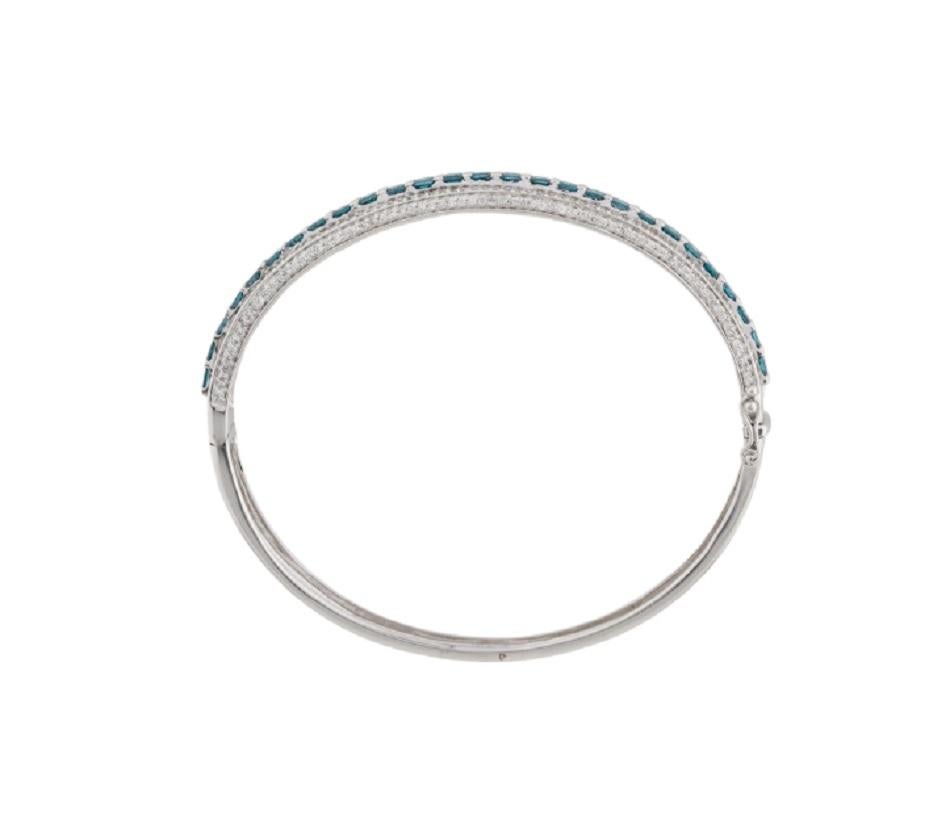 Beautiful bracelet made of real natural diamonds and solid 14 k white gold. White diamonds encircle the blue diamond that is in its natural state. When you are about to halt the performance, the bracelet's Push Clasp, Double Latch, will make sure it