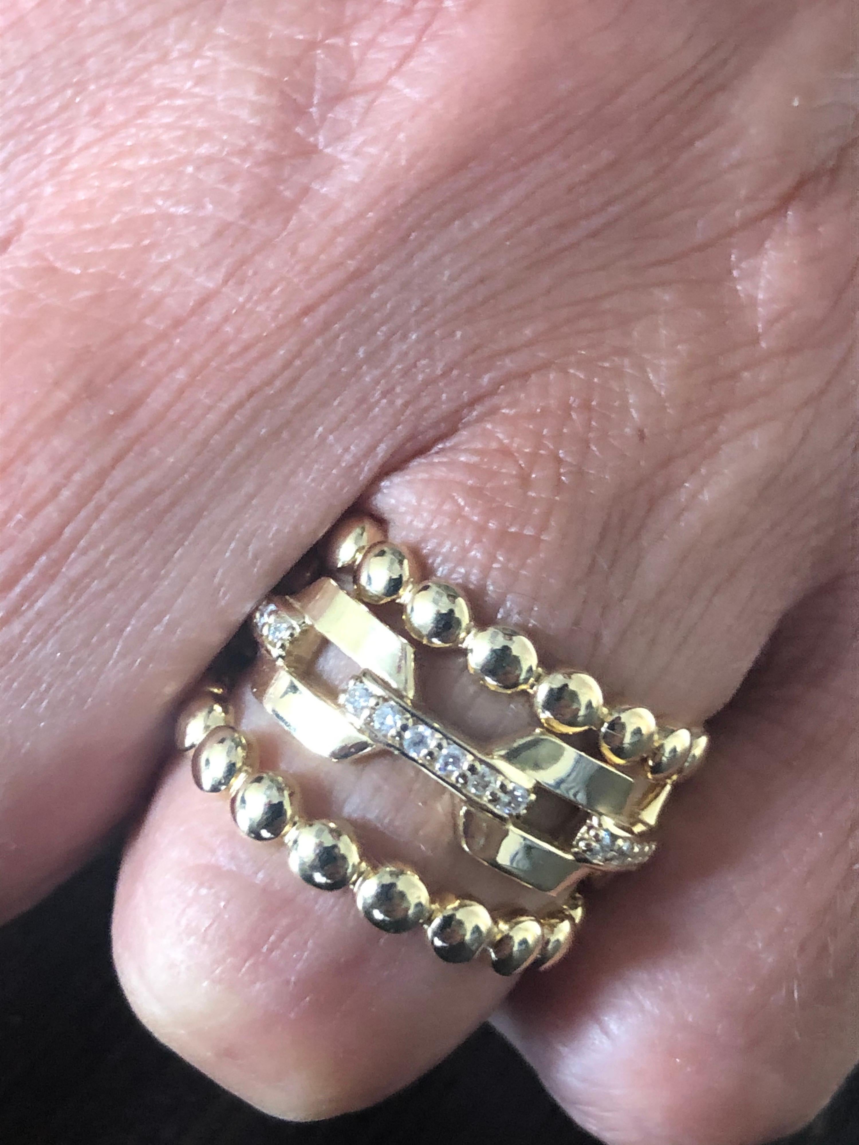 Italian made Yellow gold rings manufactured in 14K. Two yellow beaded rings with a chain link diamond ring. The carat weight is 0.30, the color and clarity is G, SI1-SI2. The rings are sold as a set. The rings are a size 7.