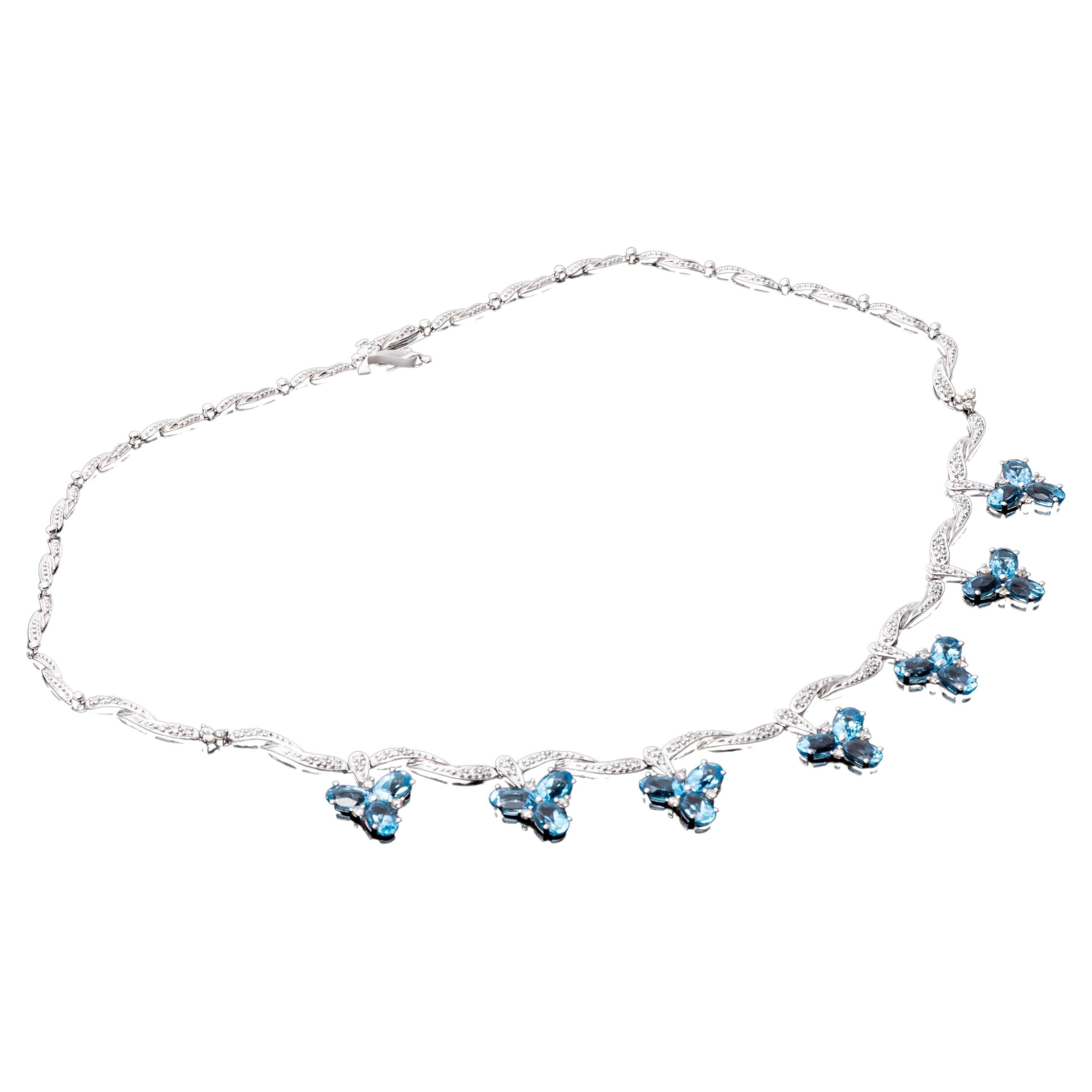 Collier à franges 14 carats avec grappe de diamants ondulants et de topazes bleues