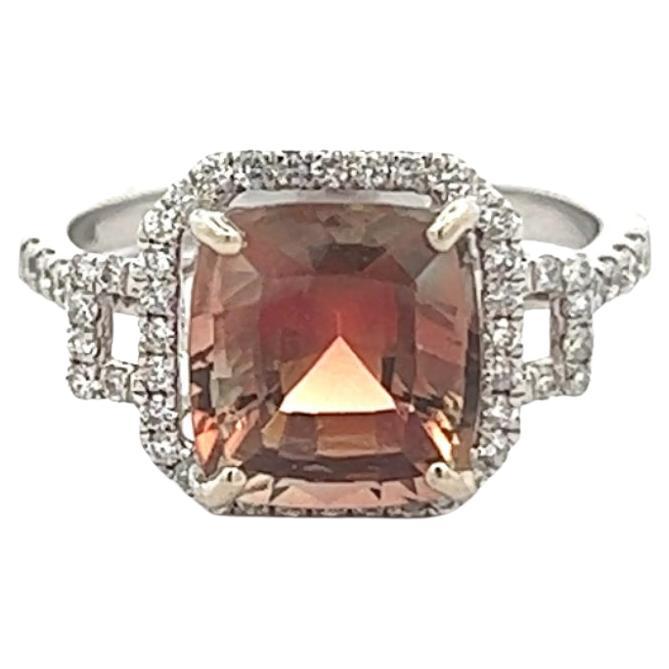 A beautifully colored 3.01 ct sunstone from Butte Oregon set within a halo of brilliant diamonds. The ring is crafted of 14k white gold and is a size 6 (sizeable). 
