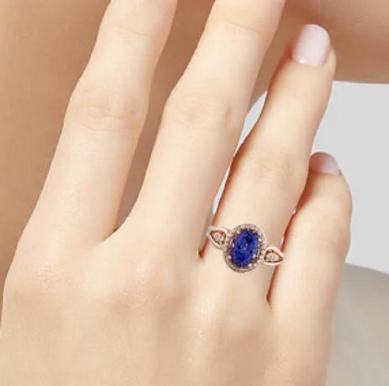 This is a gorgeous diamond ring stamped with tanzanite in solid 14K rose gold. The mesmerizing round brilliant diamonds have an excellent look and is set on top of a timeless 14K rose gold band.

*****
Details:
►Metal: Rose Gold
►Gold Purity: