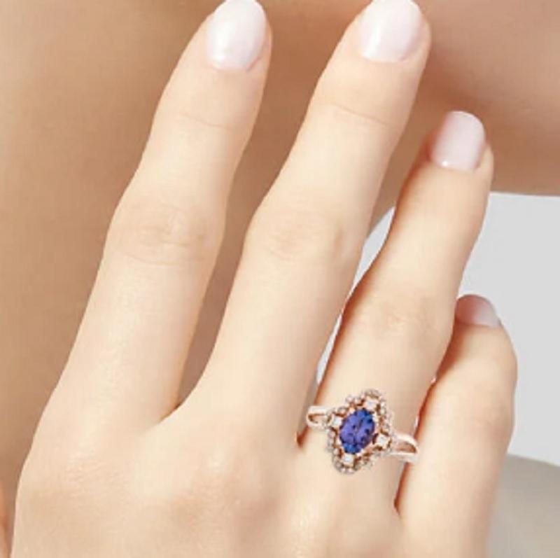 This is a gorgeous diamond ring with tanzanite stamped in solid 14K rose gold. The shinny round brilliant diamonds have an excellent look and is set on top of a timeless 14K rose gold band along with tanzanite.

*****
Details:
►Metal: Rose