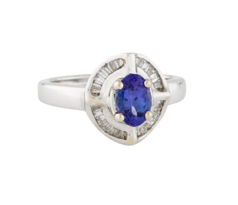 This is a gorgeous tanzanite & diamond ring stamped in solid 14K white gold. The perfectly placed round brilliant diamonds have an excellent look and is set on top of a timeless 14K white gold ban and the blue gemstone.

*****
Details:
►Metal: White