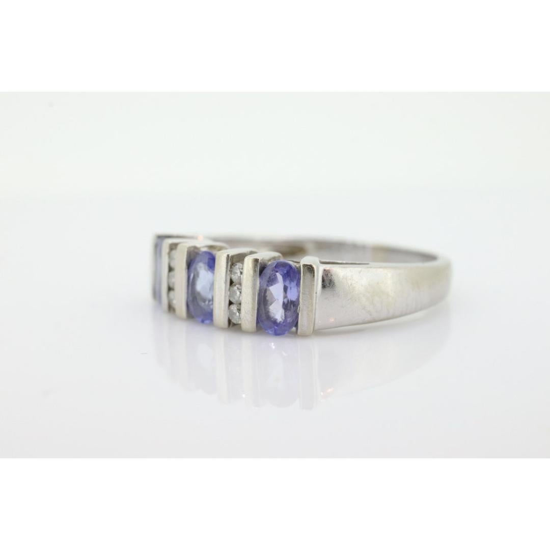 14k Tanzanite Oval and Diamond Channel Anniversary ring. Channel set eternity In Good Condition For Sale In Port Charlotte, FL