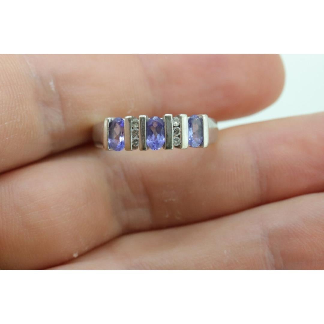 14k Tanzanite Oval and Diamond Channel Anniversary ring. Channel set eternity For Sale 1