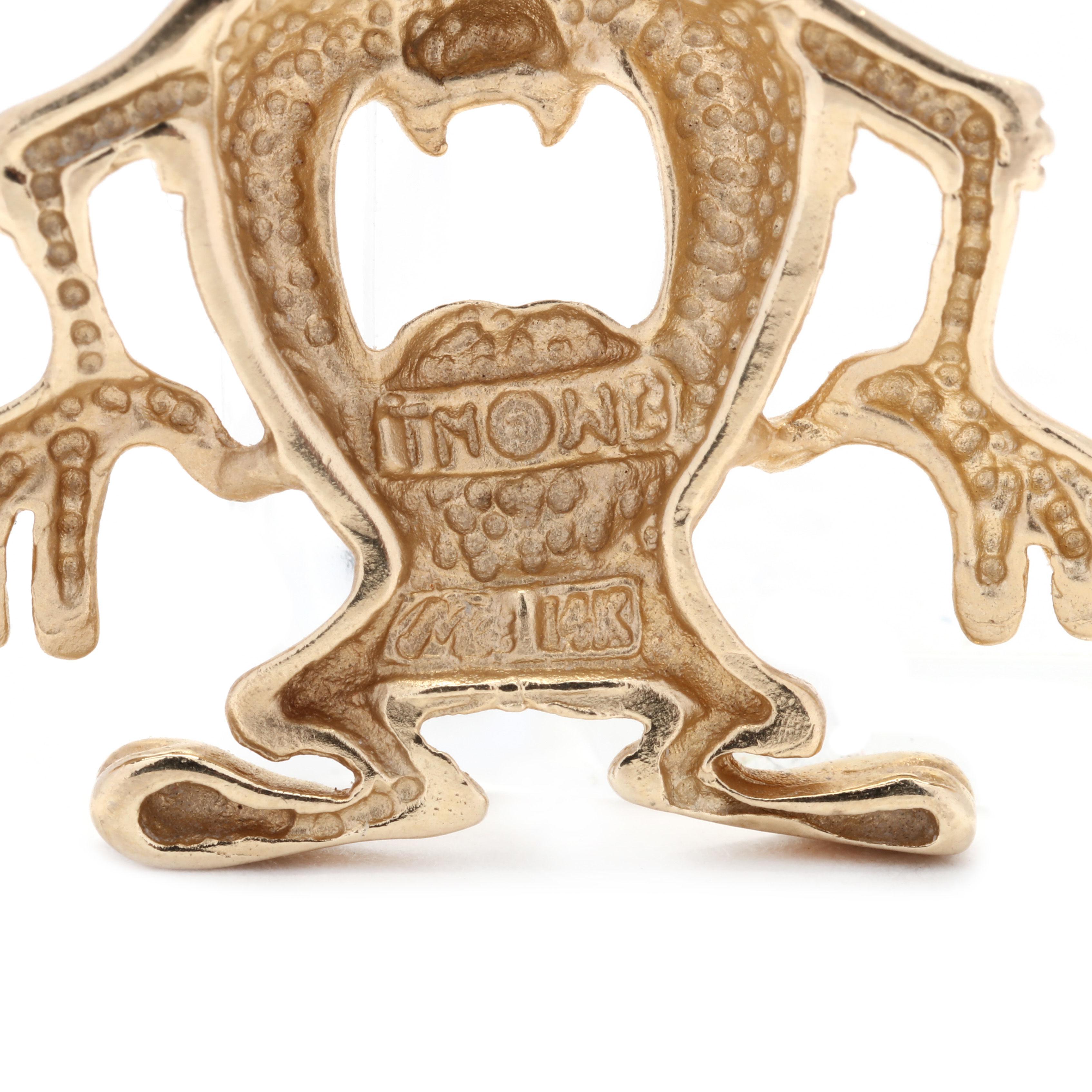 A vintage 14 karat yellow gold tazmanian devil charm. This charm features the Looney Toons 