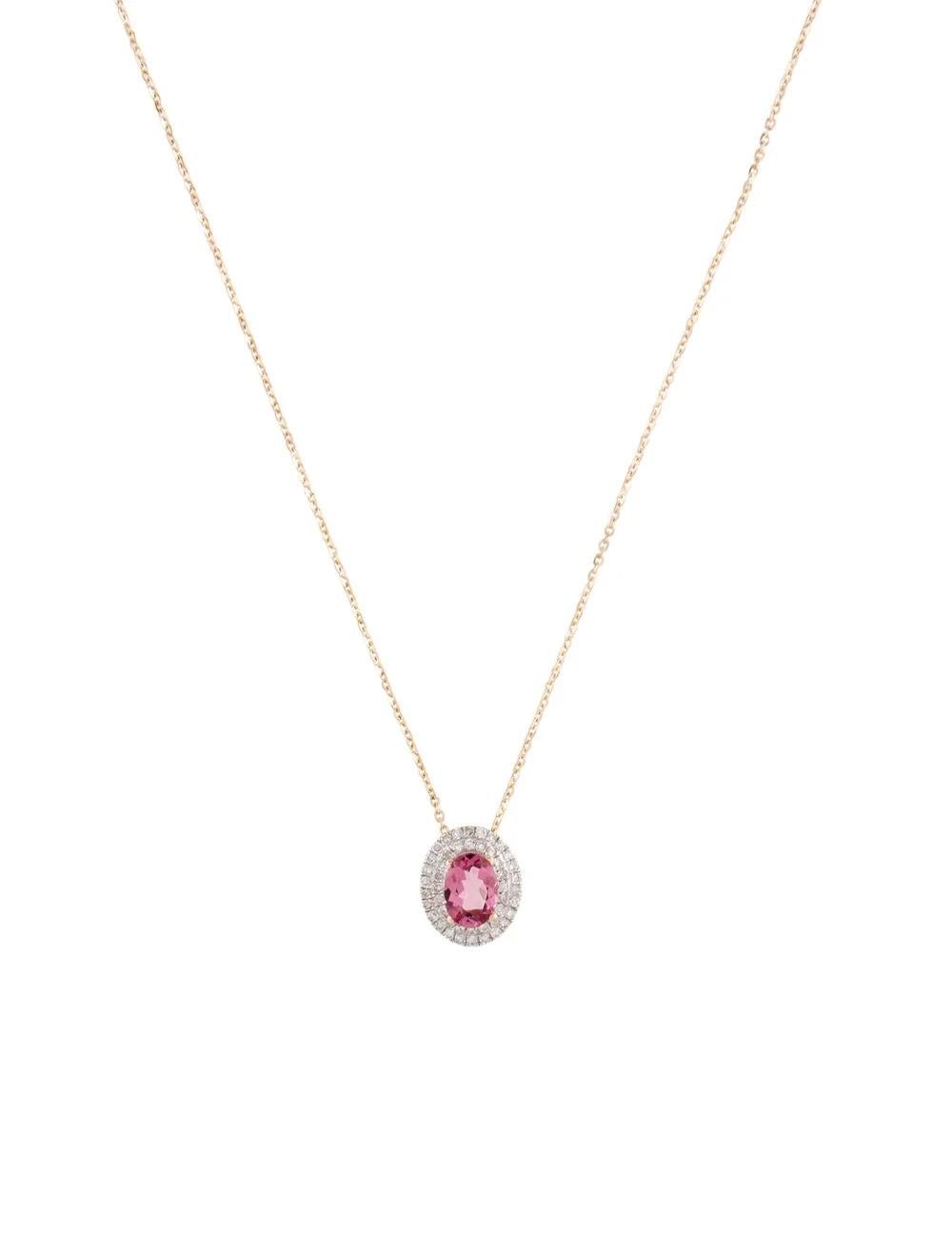 Indulge in timeless elegance with this exquisite 14K Yellow Gold Necklace, adorned with a captivating Oval Modified Brilliant Tourmaline and dazzling Diamonds. Crafted to perfection, this necklace is a statement of sophistication and