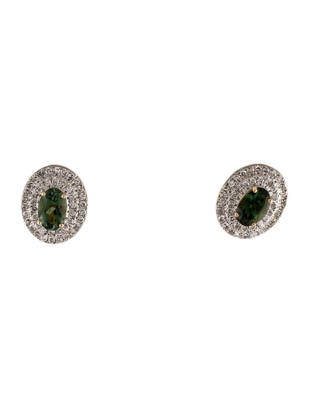 Experience timeless elegance with these exquisite 14K White Gold & 14K Yellow Gold earrings featuring a stunning 0.98 Carat Oval Modified Brilliant Tourmaline paired with sparkling Diamonds. Crafted to perfection, these earrings exude luxury and